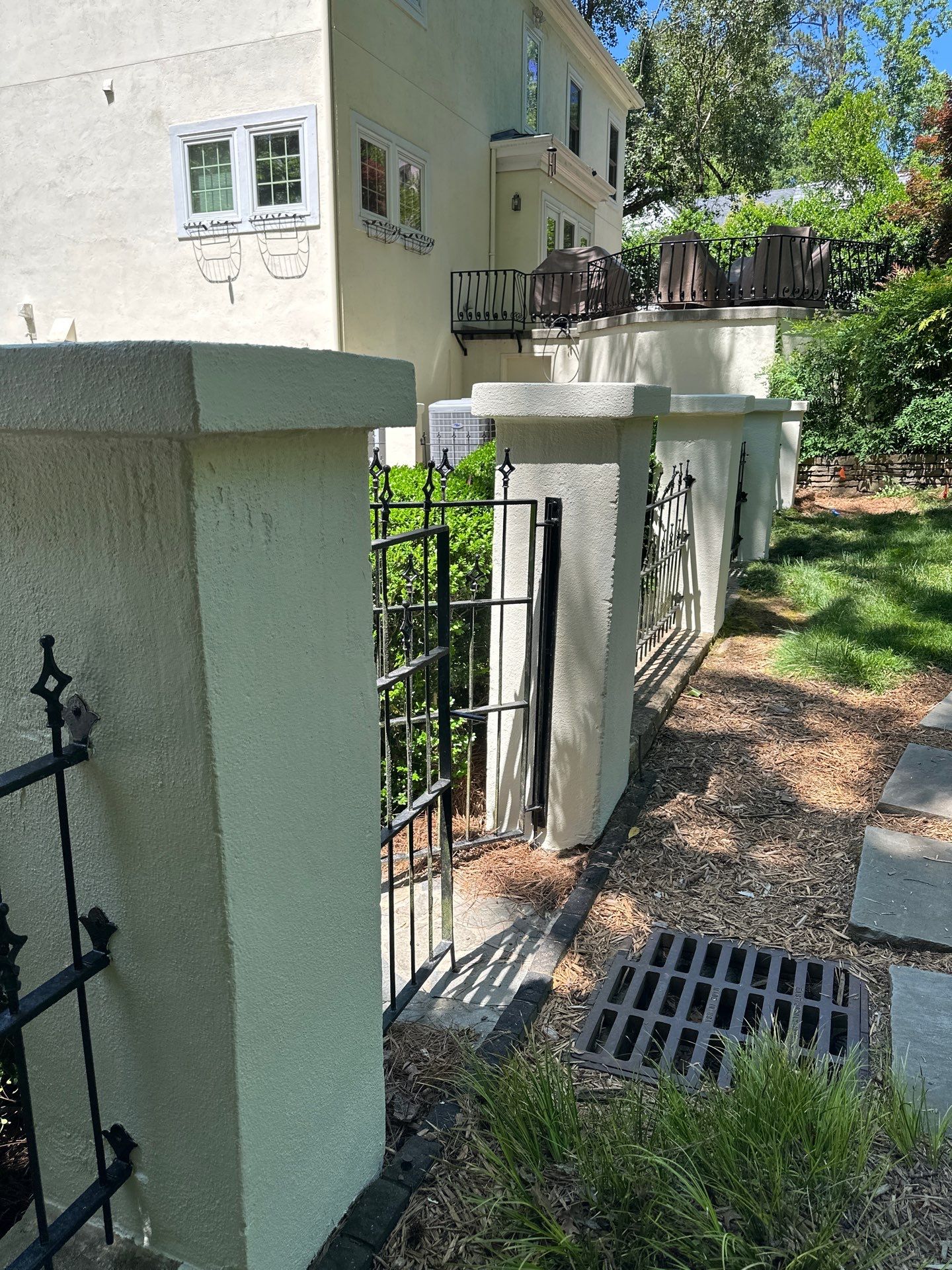 Rear Exterior Upgrade: Railings, Fence, and Stucco Column Restoration by Atlanta's Paint Doctor