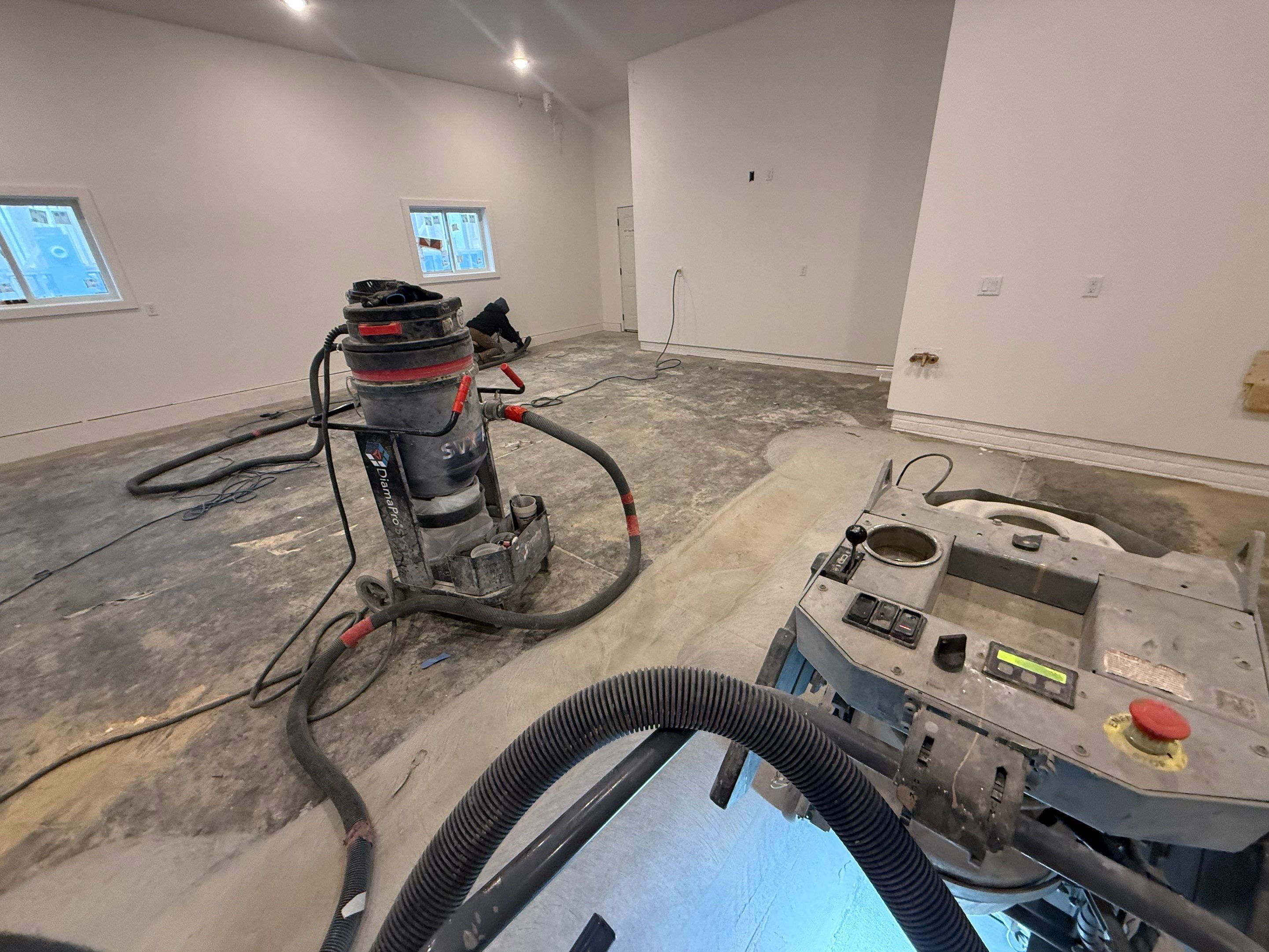 Multi-Car Garage Epoxy Floor Coating and Concrete Finishing in Sioux Falls by Select Painting, Coatings & Garage Cabinets