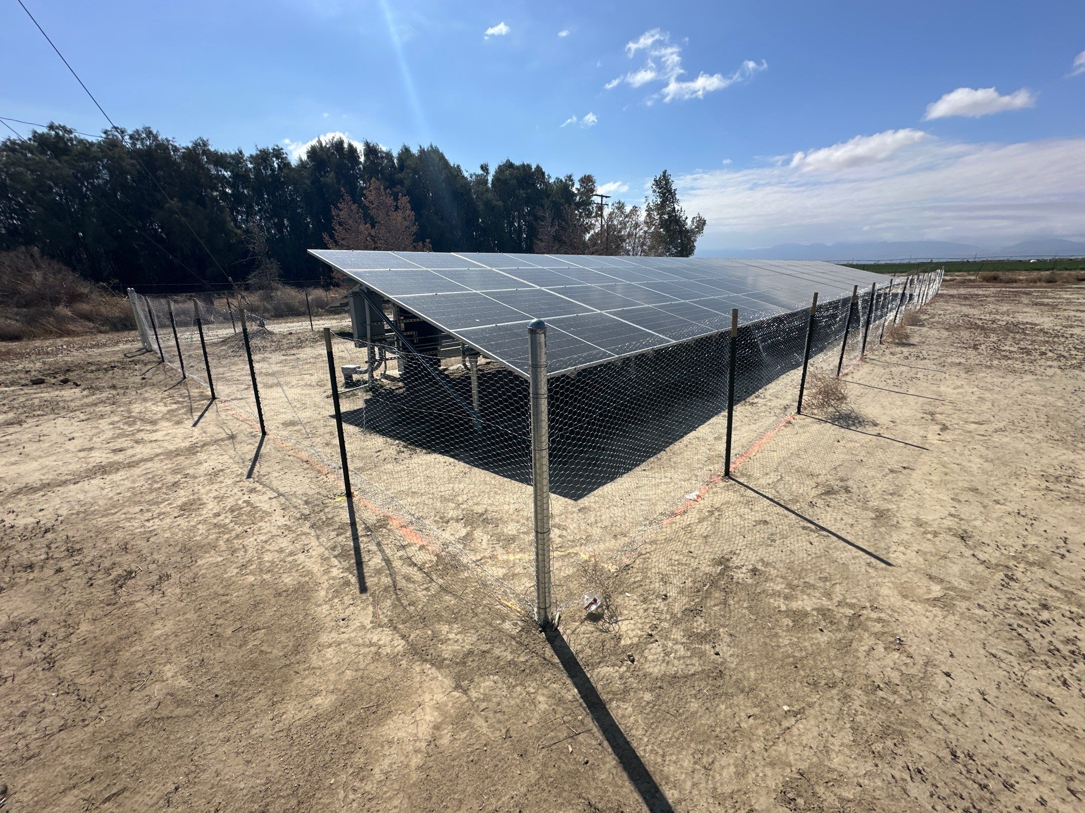 Large-Scale Ground-Mount Solar and Tesla Powerwall Battery Installation by AWS Solar