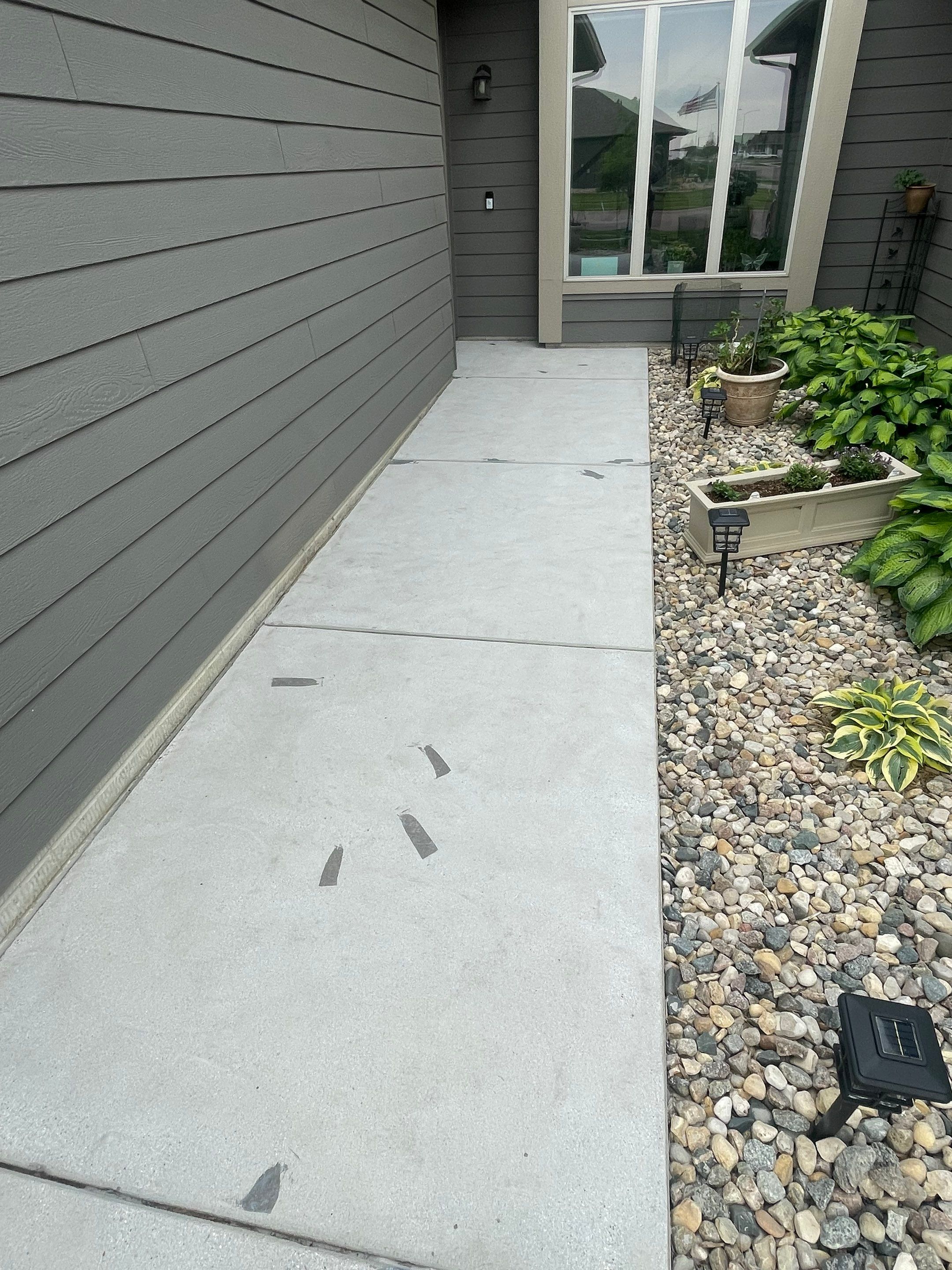 Custom Concrete Coating for Sioux Falls Patio and Front Walkway by Select Painting, Coatings & Garage Cabinets