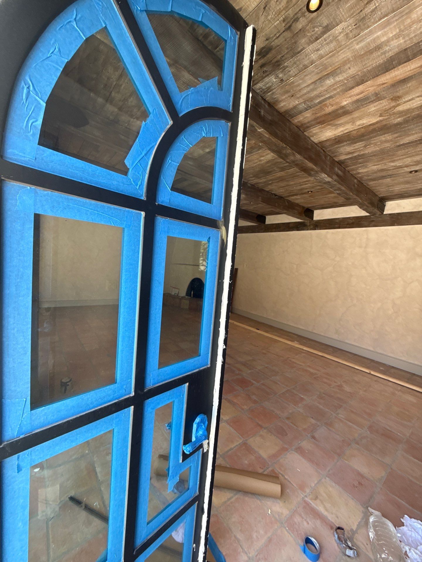 Arched Black Metal French Door Installation and Finishing in Fort Worth by Solara Custom Living