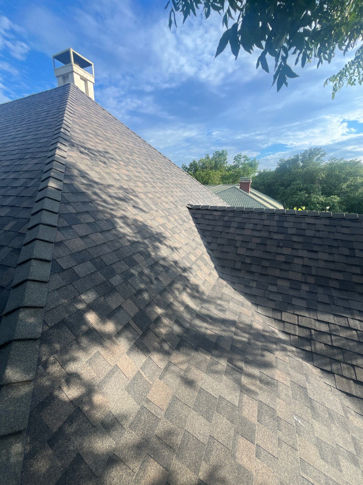 Tan exterior with IKO Driftshake by Tejas Roofworks + Restoration