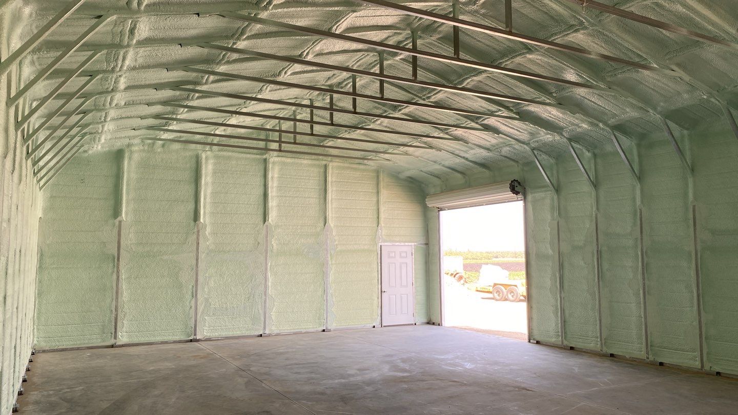 Foam insulation installed in shop by Straight Edge Roofing Inc