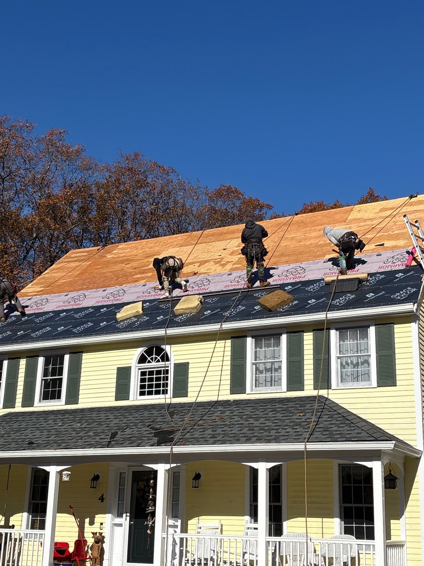 Chelmsford Premium Roof: Onyx Black Shingles with Standing Seam Metal Porch by Mighty Dog Roofing of Greater Middlesex County