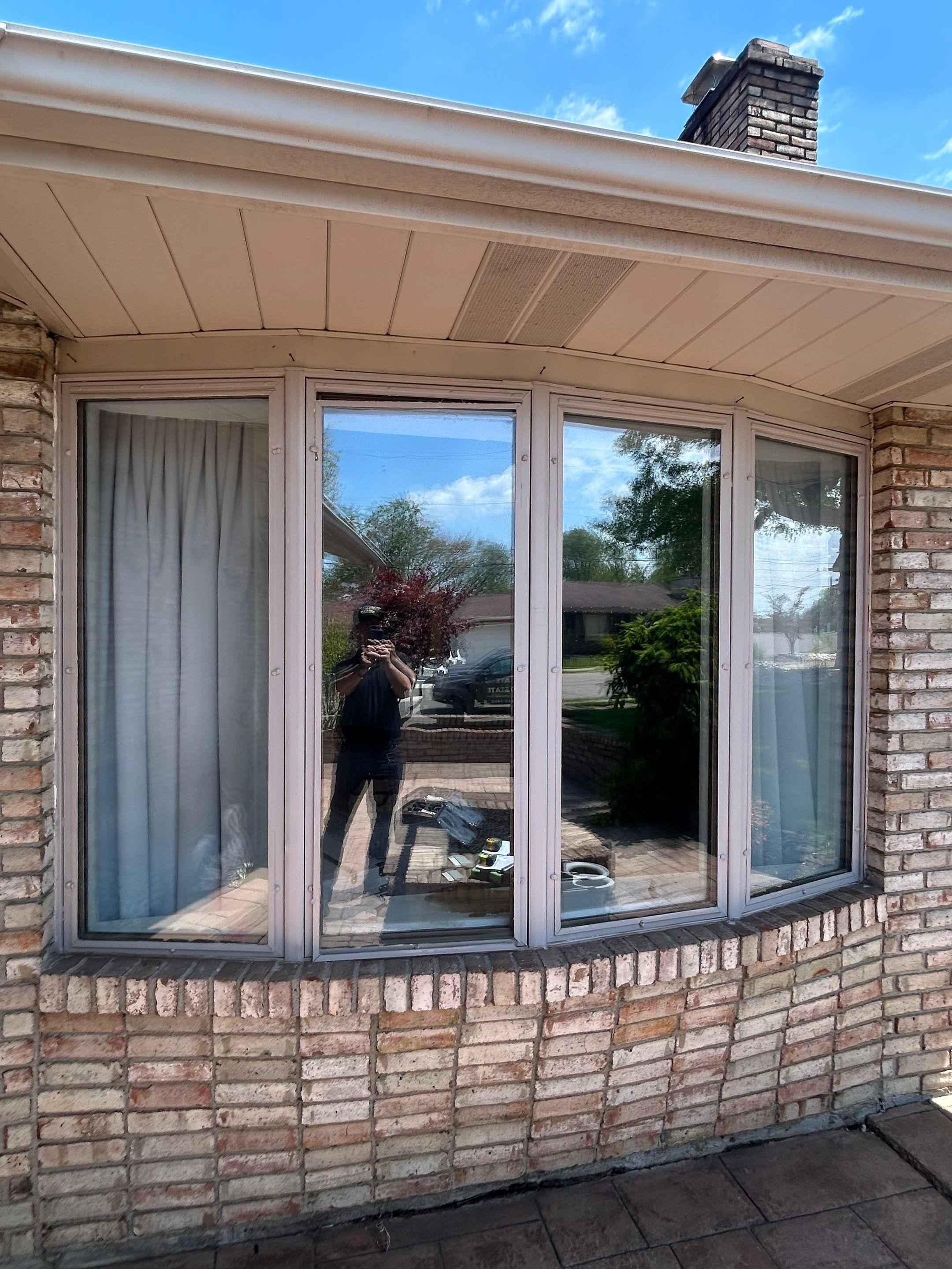 Four-Panel Bay Window Installation with Beige Trim in Weirton by Ohio State Windows