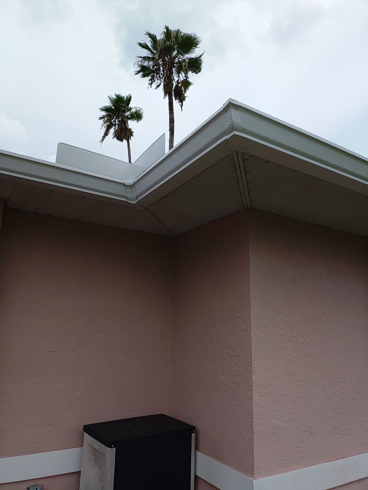 Replace gutter using White Down Spouts in Cape Coral FL by Gutter Professors