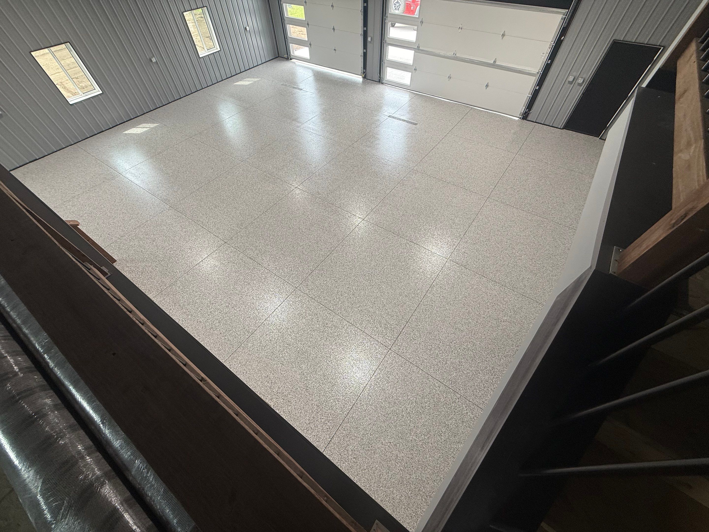 Polyaspartic Garage Floor Coating with Decorative Flake in Wentworth by Select Painting, Coatings & Garage Cabinets