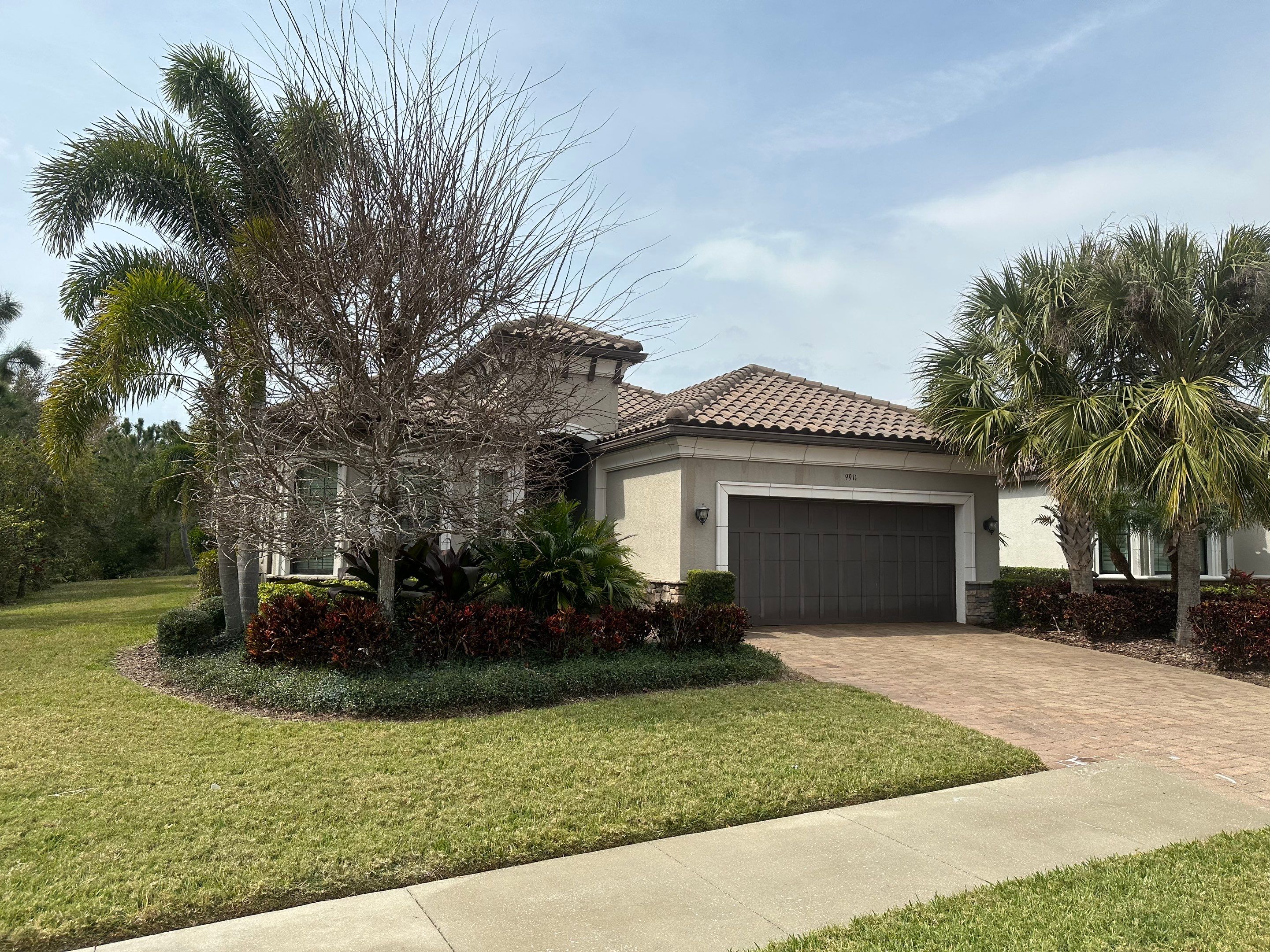 Concrete Tile Roof, Paver Pool Deck, Screen Enclosure & Driveway Cleaning in Artisan Lakes Esplanade, Palmetto, FL | Sunshine AquaWash by Sunshine AquaWash