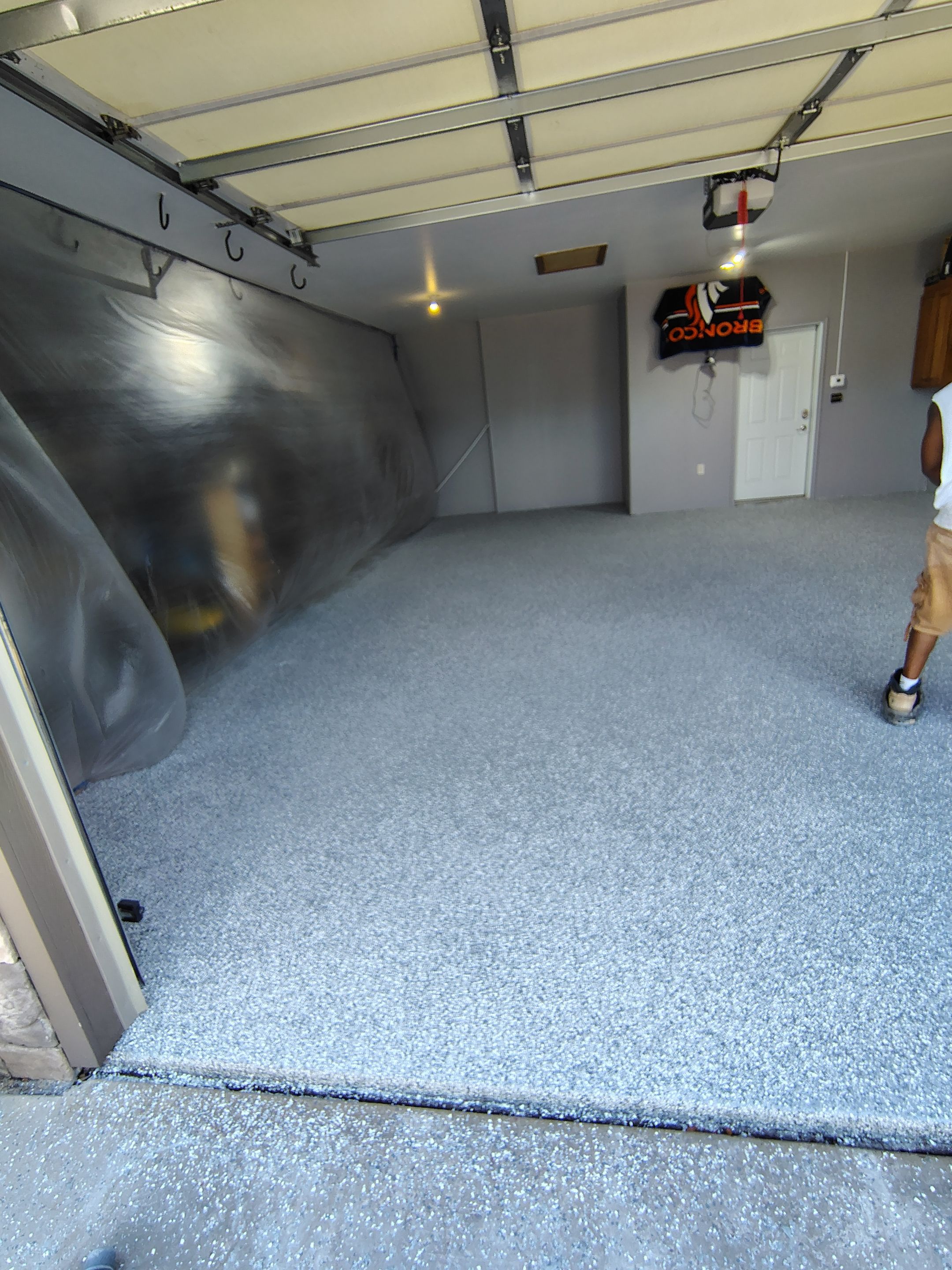 Grey Flecked Epoxy Garage Floor Installation in Sioux Falls by Select Painting, Coatings & Garage Cabinets