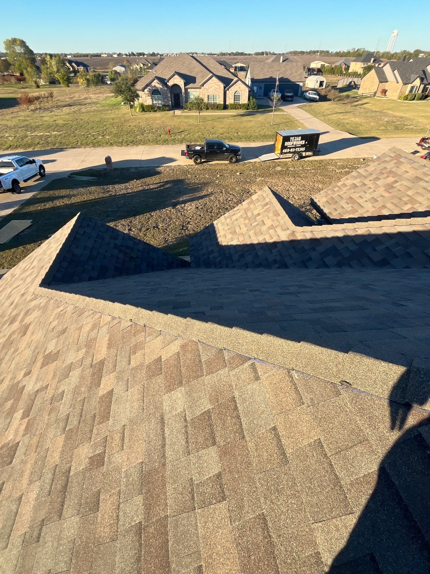 Brick with Malarkey Natural Wood by Tejas Roofworks + Restoration