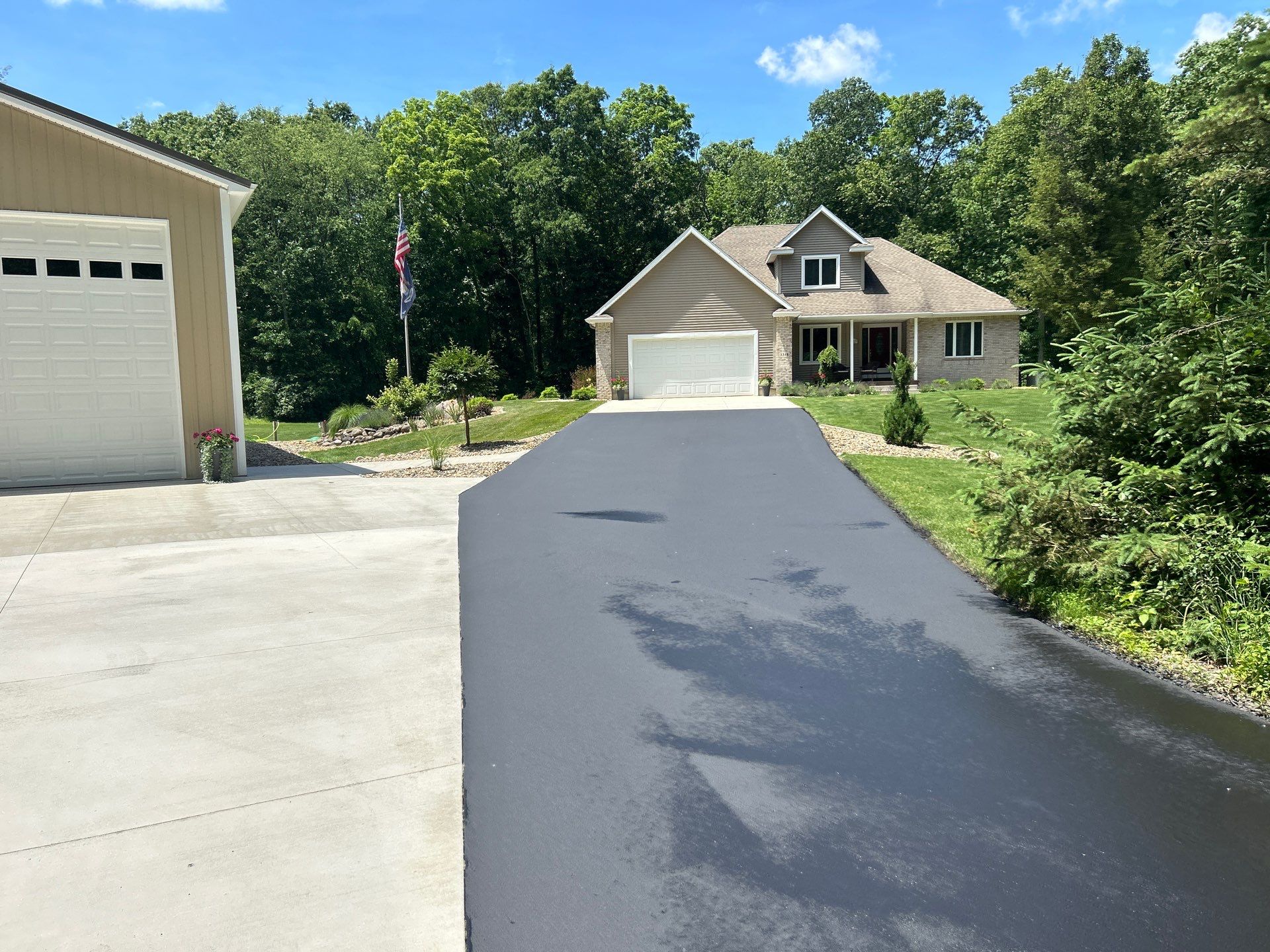 High end residential driveway by Quality Asphalt & Maintenance LLC
