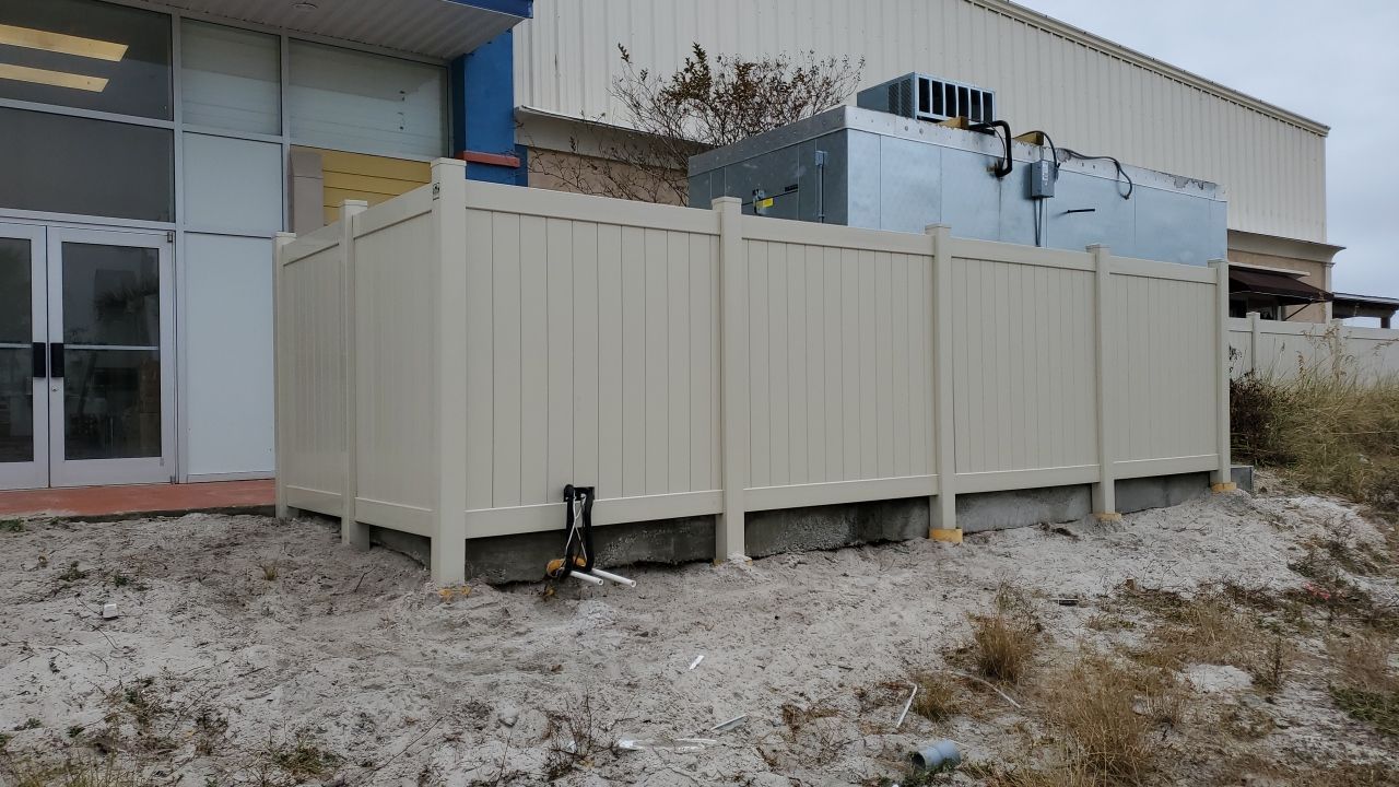 Commercial using Tan 6' Vinyl by Hip Square Fence Inc.