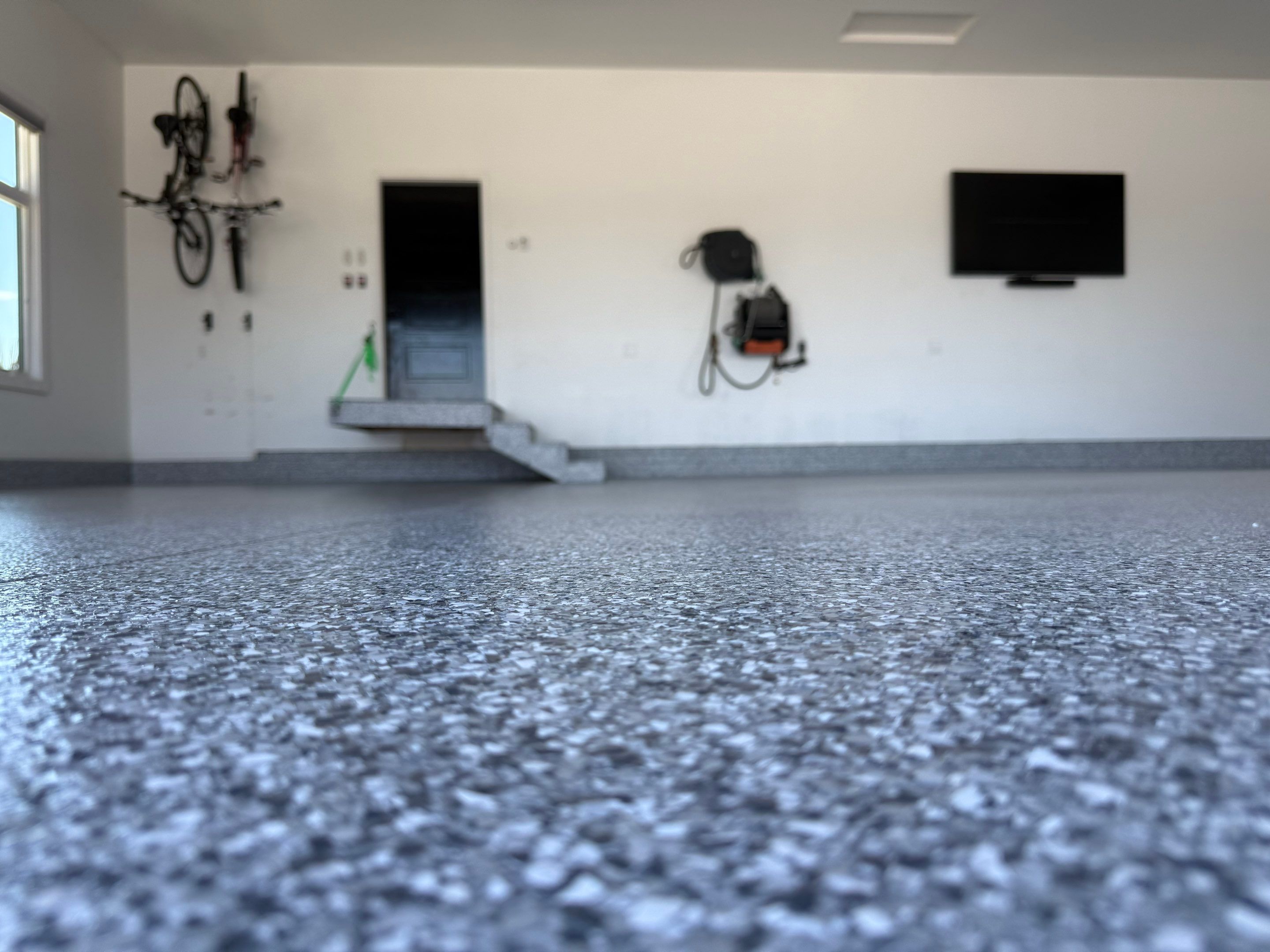 Gravel Flake Garage Floor Coating in Yankton by Select Painting, Coatings & Garage Cabinets