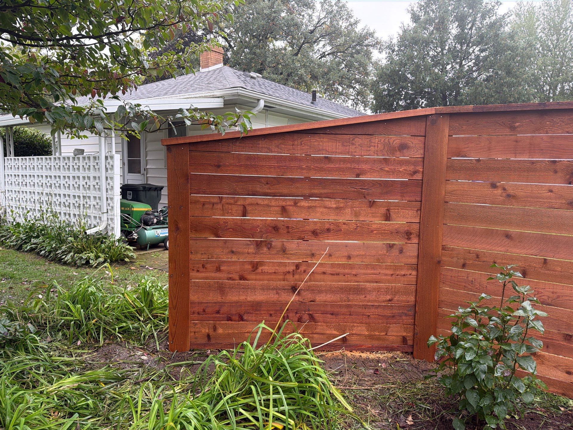 Stained Horizontal Cedar Wood Privacy Fence in Cedar Falls by Perfect Picket Fence and Stain