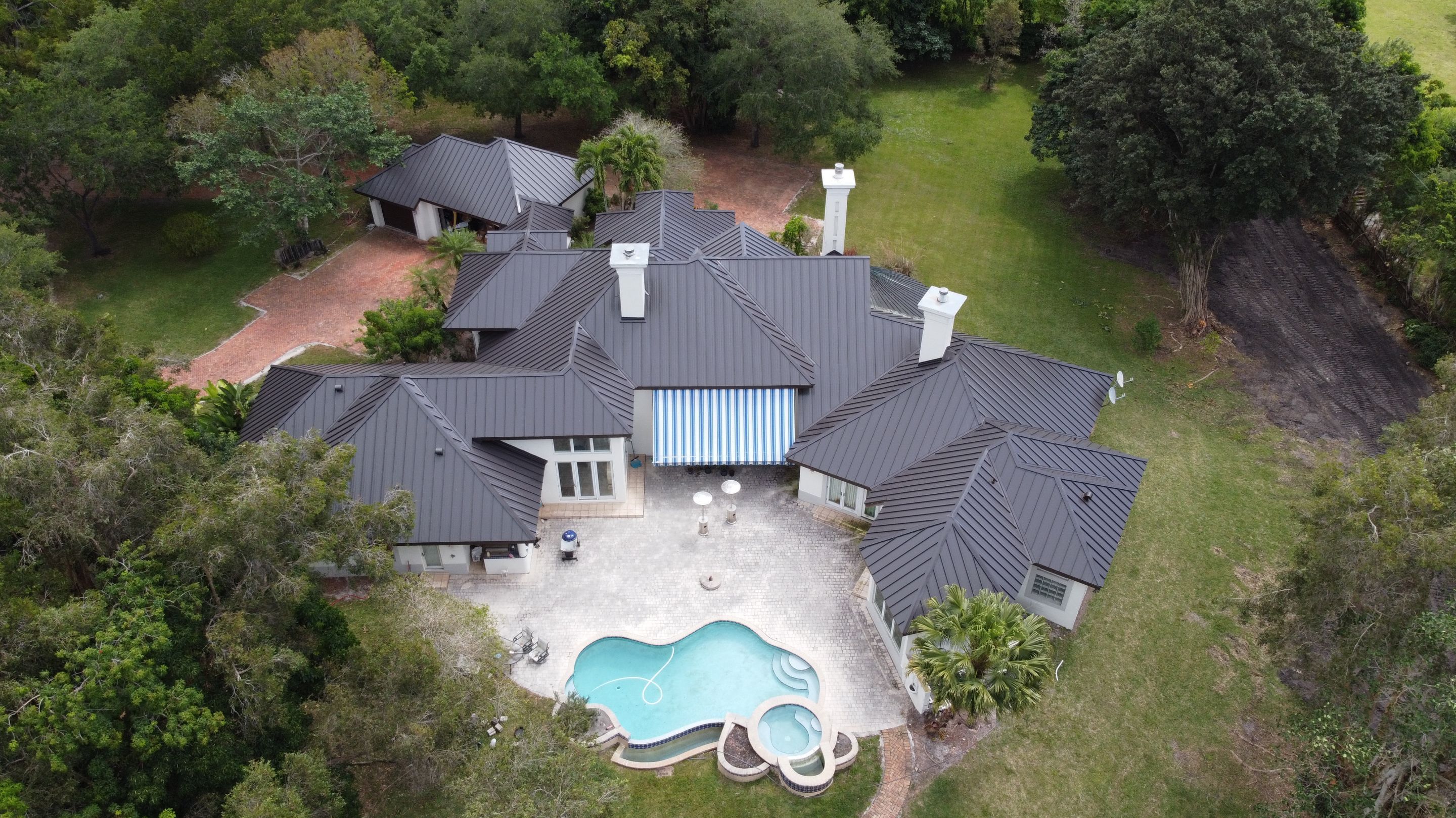Residential Roofing Installation using 1" Nail strip metal roof by BLUES BROTHERS ROOFING