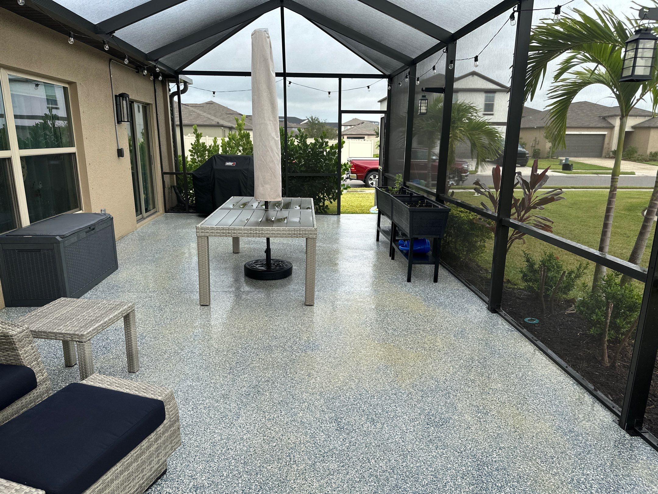 Lanai & Patio Cleaning with Epoxy-Coated Concrete Floor in Trevesta Community, Palmetto, FL | Sunshine AquaWash by Sunshine AquaWash