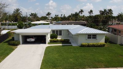 Residential Roofing Installation using 1" Nail strip metal roof