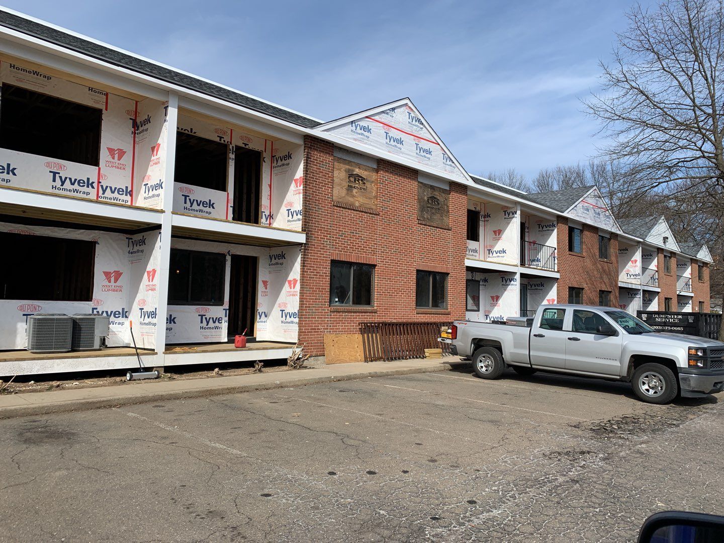 Commercial Roofing Installation using EPDM with white gutters by A Plus Exterior