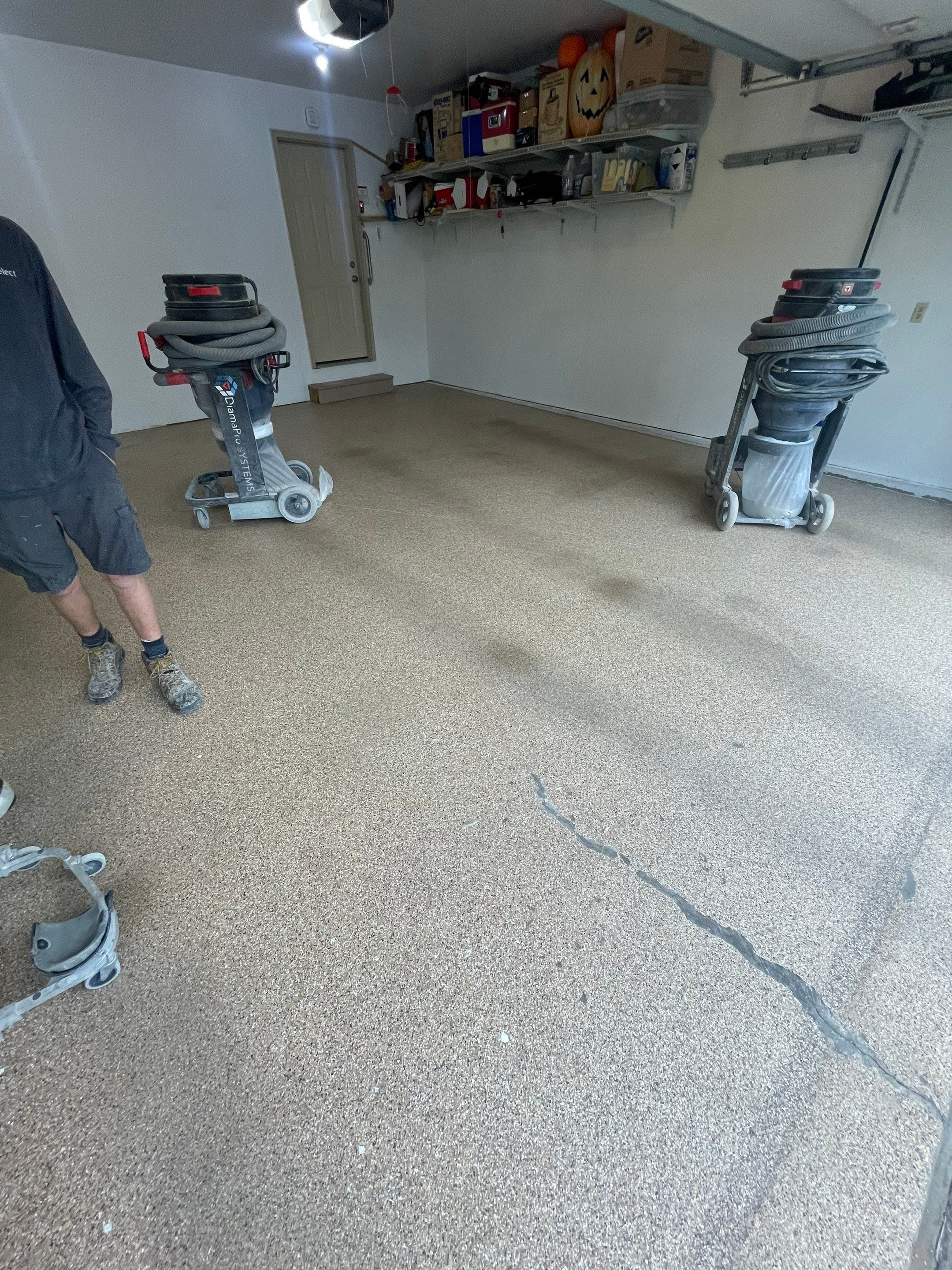 Sioux Falls Residential Garage Floor Coating with Speckled Epoxy Finish by Select Painting, Coatings & Garage Cabinets