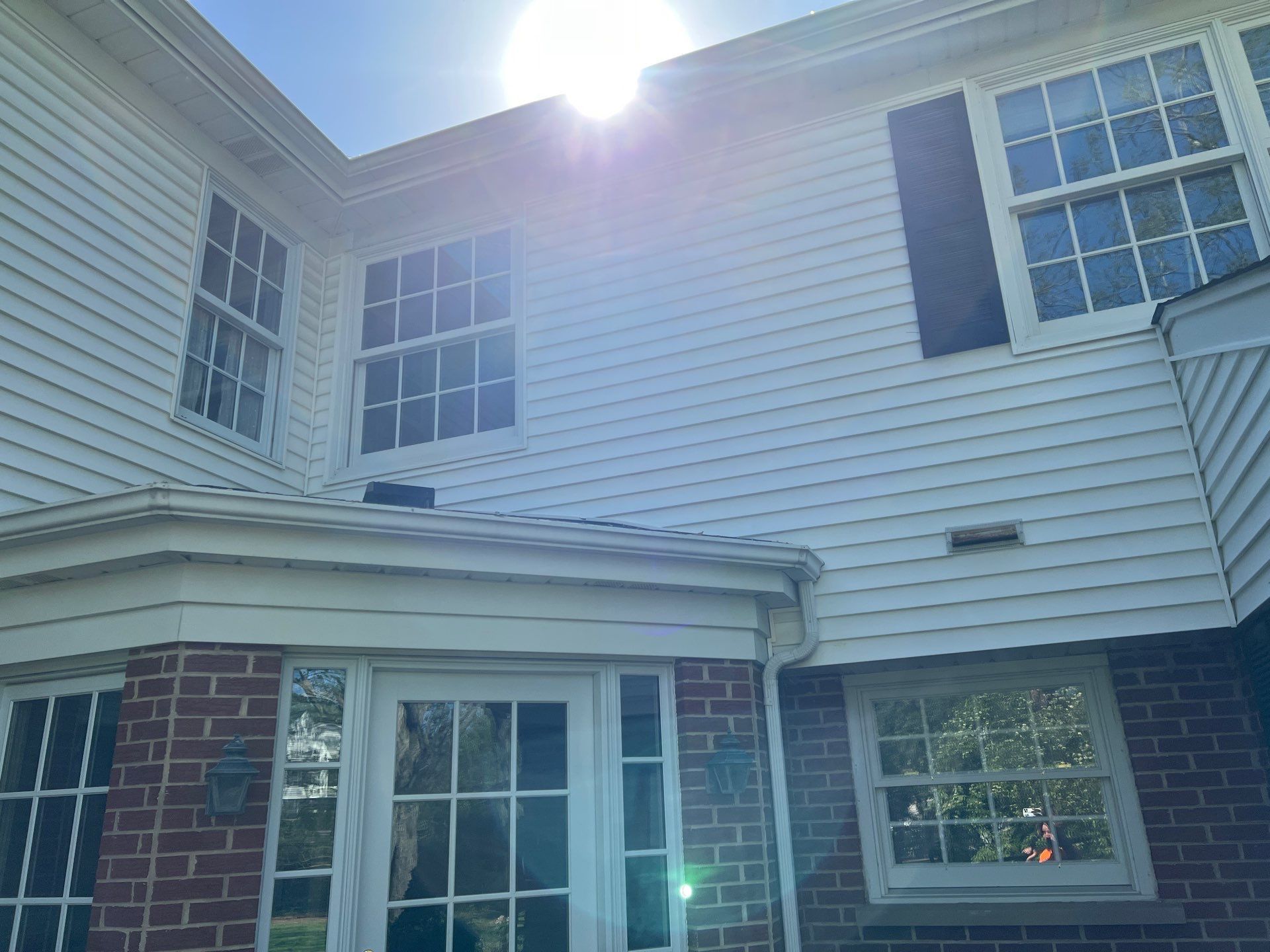 Housewashing  using Algaecide, soft wash soap by Northern Power Washing LLC.