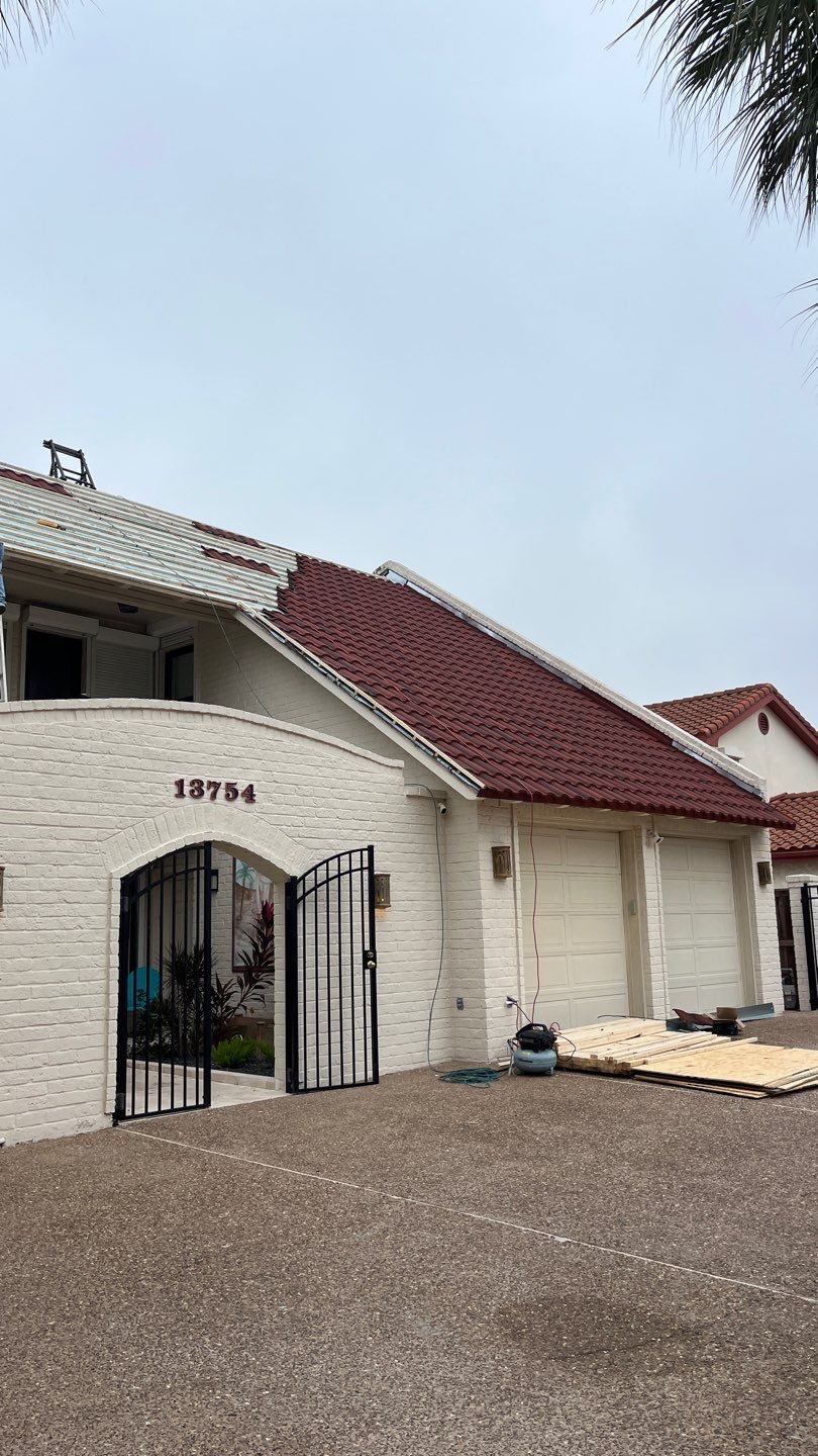 Off with the Tile and on with the TILCOR stone coated metal.  by Bayfront Roofing and Construction