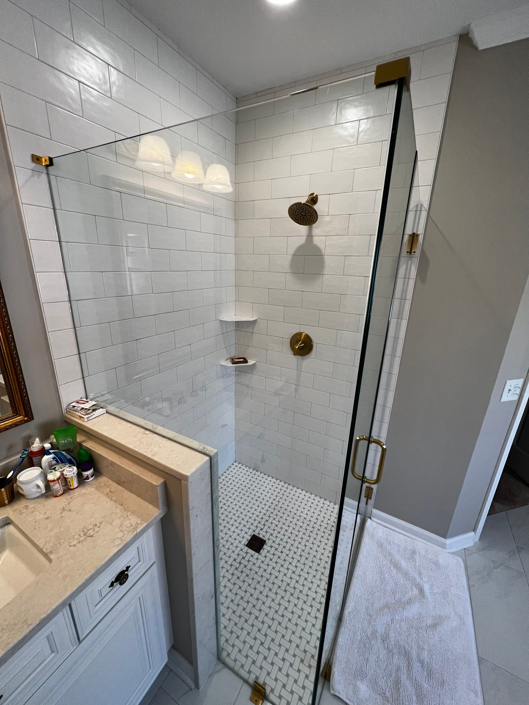 Master Bathroom Renovation with Marble Floor and Freestanding Soaking Tub by Swift Home Renovations