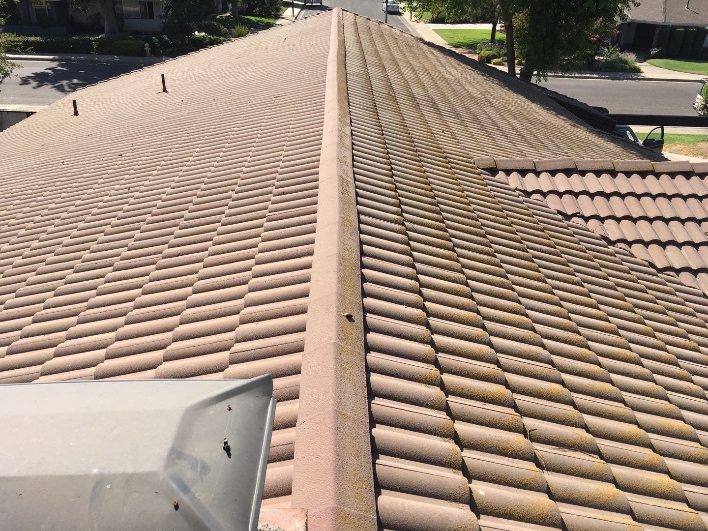 Tile roof remodel/ install OSB sheathing under tile and replace using OSB board with new underlayment, tile, and battens by Straight Edge Roofing Inc