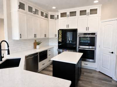 Modern White Kitchen Remodel in San Antonio Featuring Black Range Hood Before and After