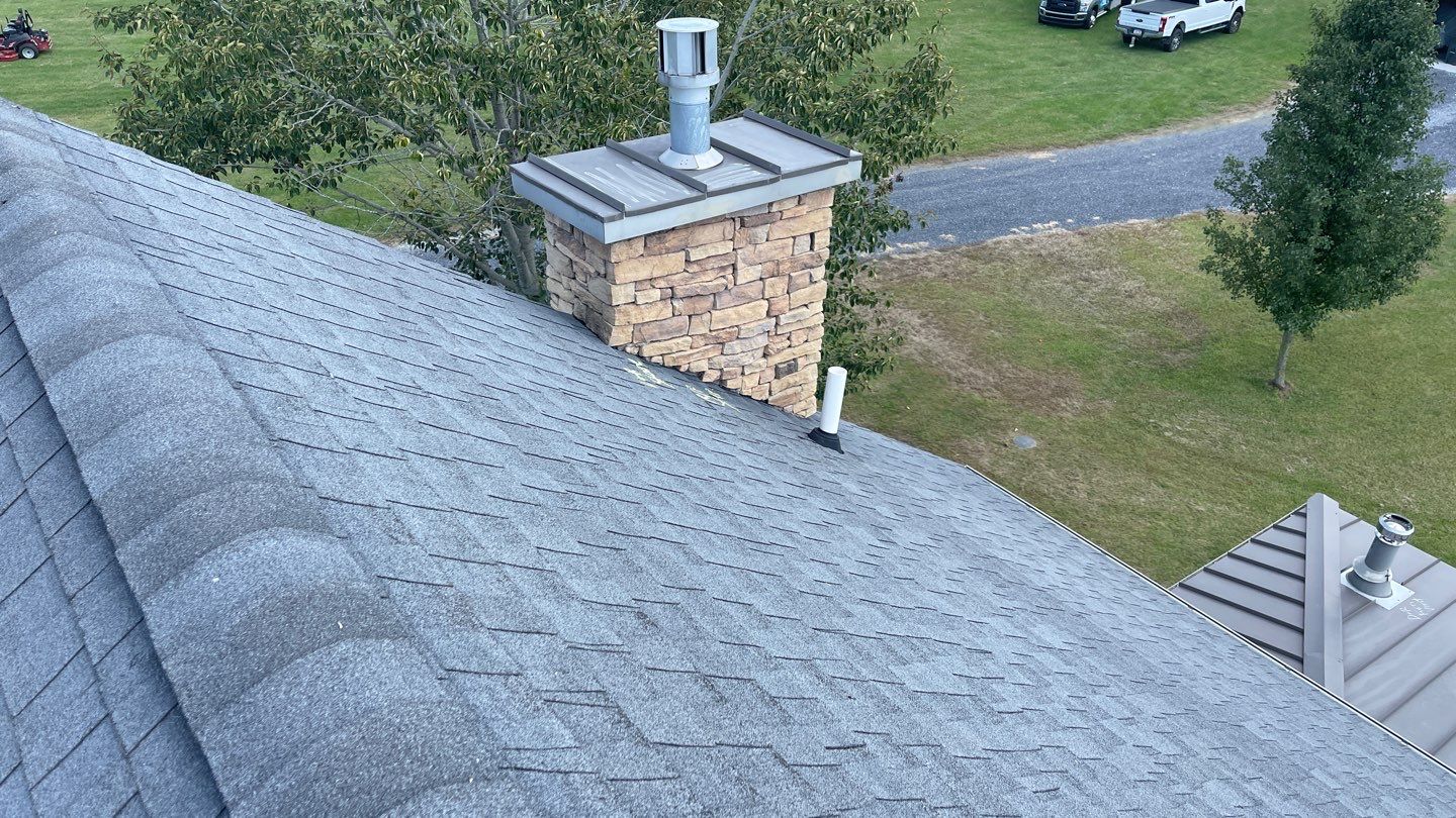 Roof Damage using Certainteed Lifetime Roofing System- Moire Black Landmark Pro shingkes with shadow ridge caps. by BulletpROOF Exteriors