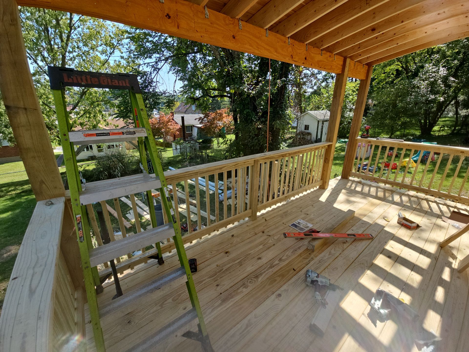 Deck and shed roof by Cousins Roofing Siding & Decks