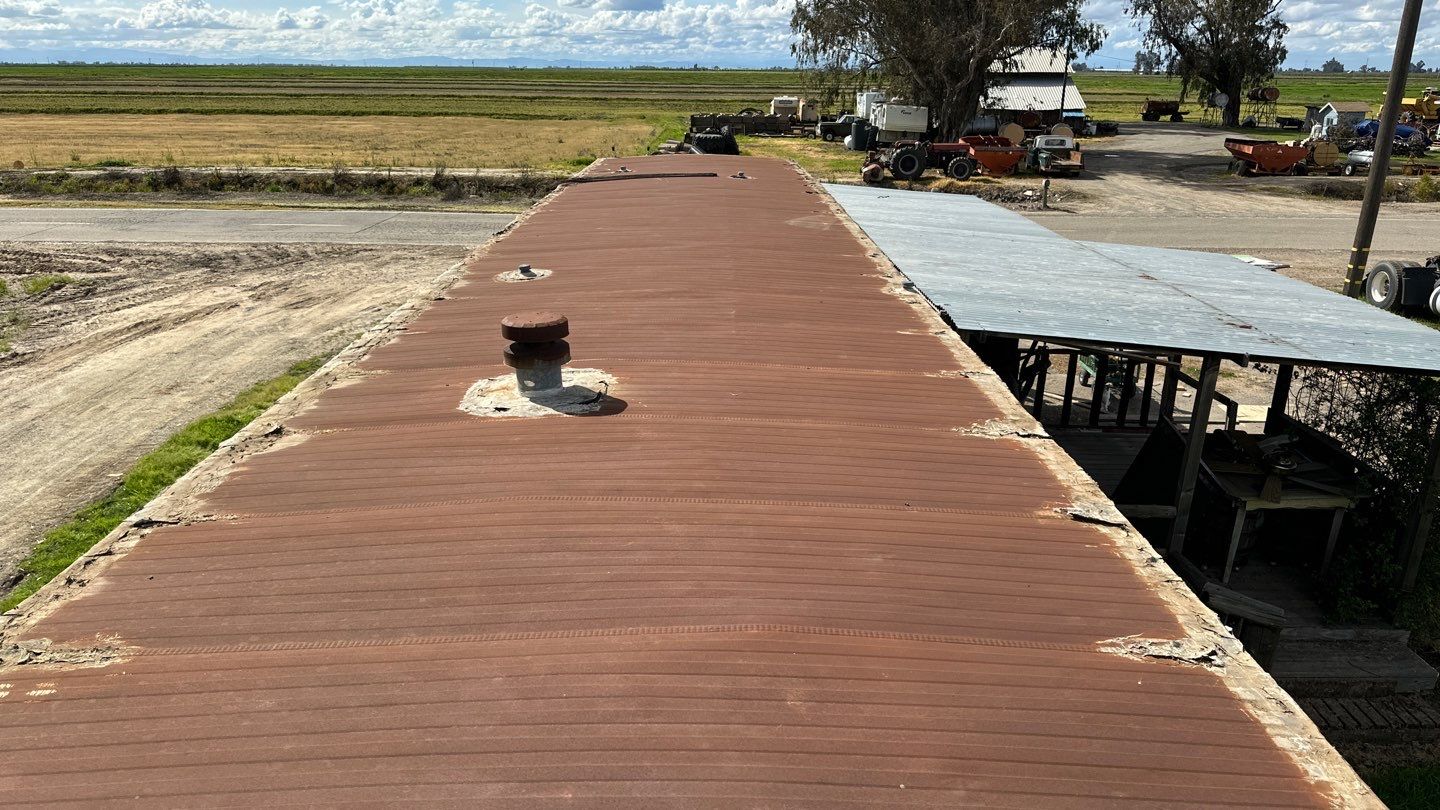 Foam and coatings on mobile home by Straight Edge Roofing Inc