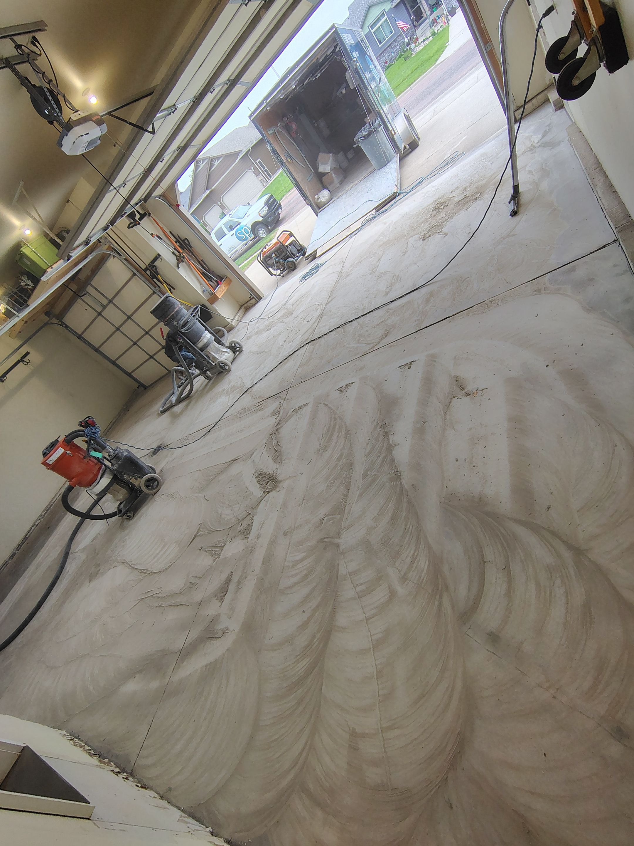 Sioux Falls Garage Floor Repair and Speckled Epoxy Coating Installation by Select Painting, Coatings & Garage Cabinets
