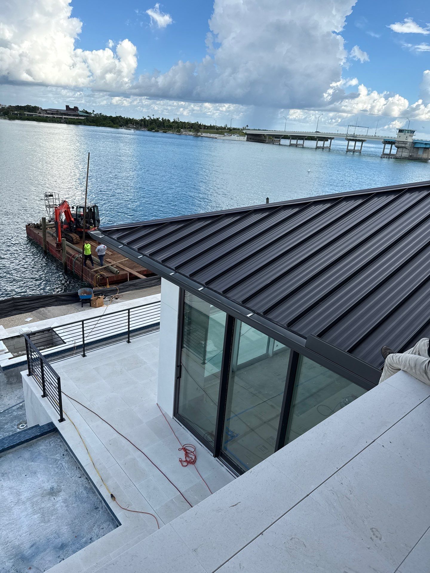 Seamless Aluminum Gutter Installation using black seamless gutters in Sarasota FL by Gutter Professors