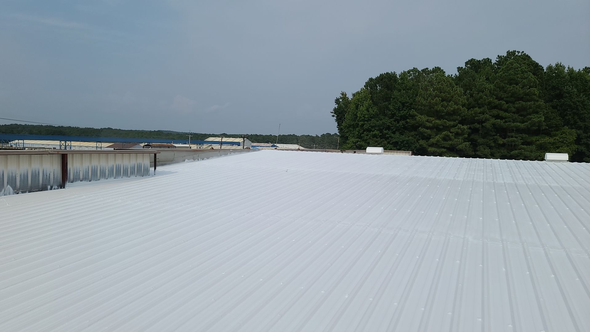Commercial Roofing Installation using Aldocoat Coatings by Hostetler Roofing