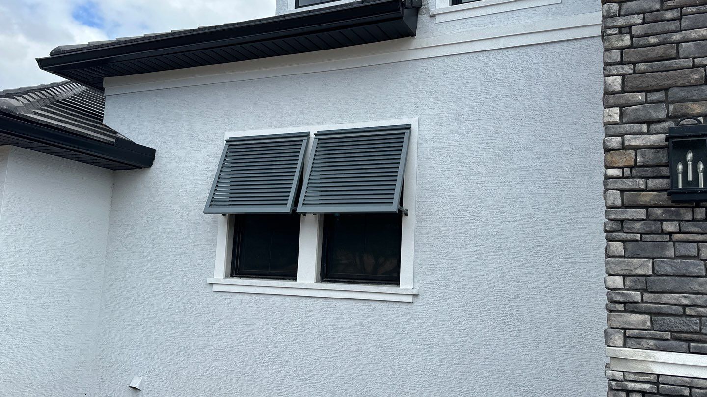 Bahama Shutters in Blue Grey by Smart Guard Shutters