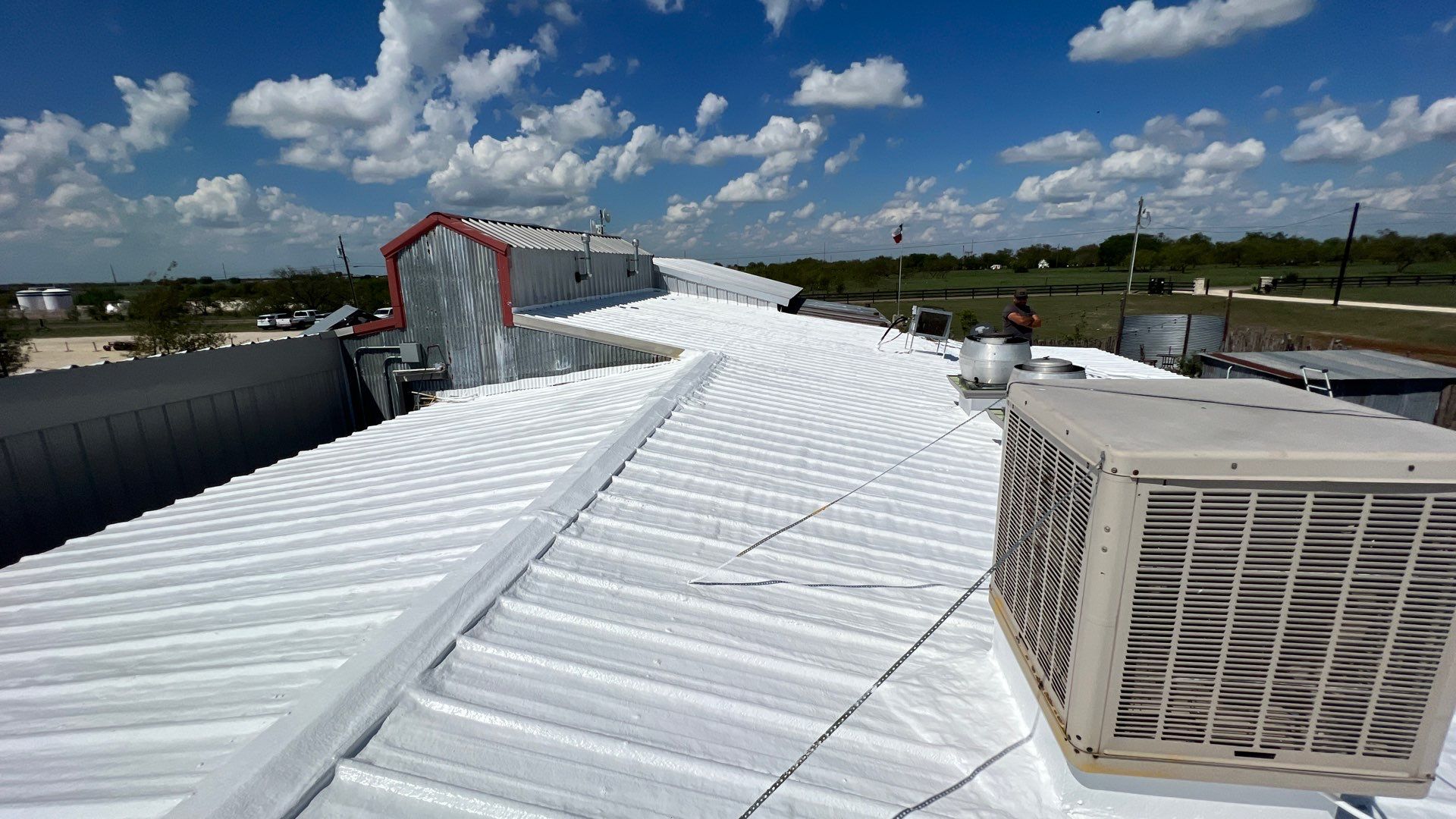 Commercial Roofing Repair using TRP #924 Eterna-Sil Premium Silicone Roof Coating by Harvey Roofing & Construction