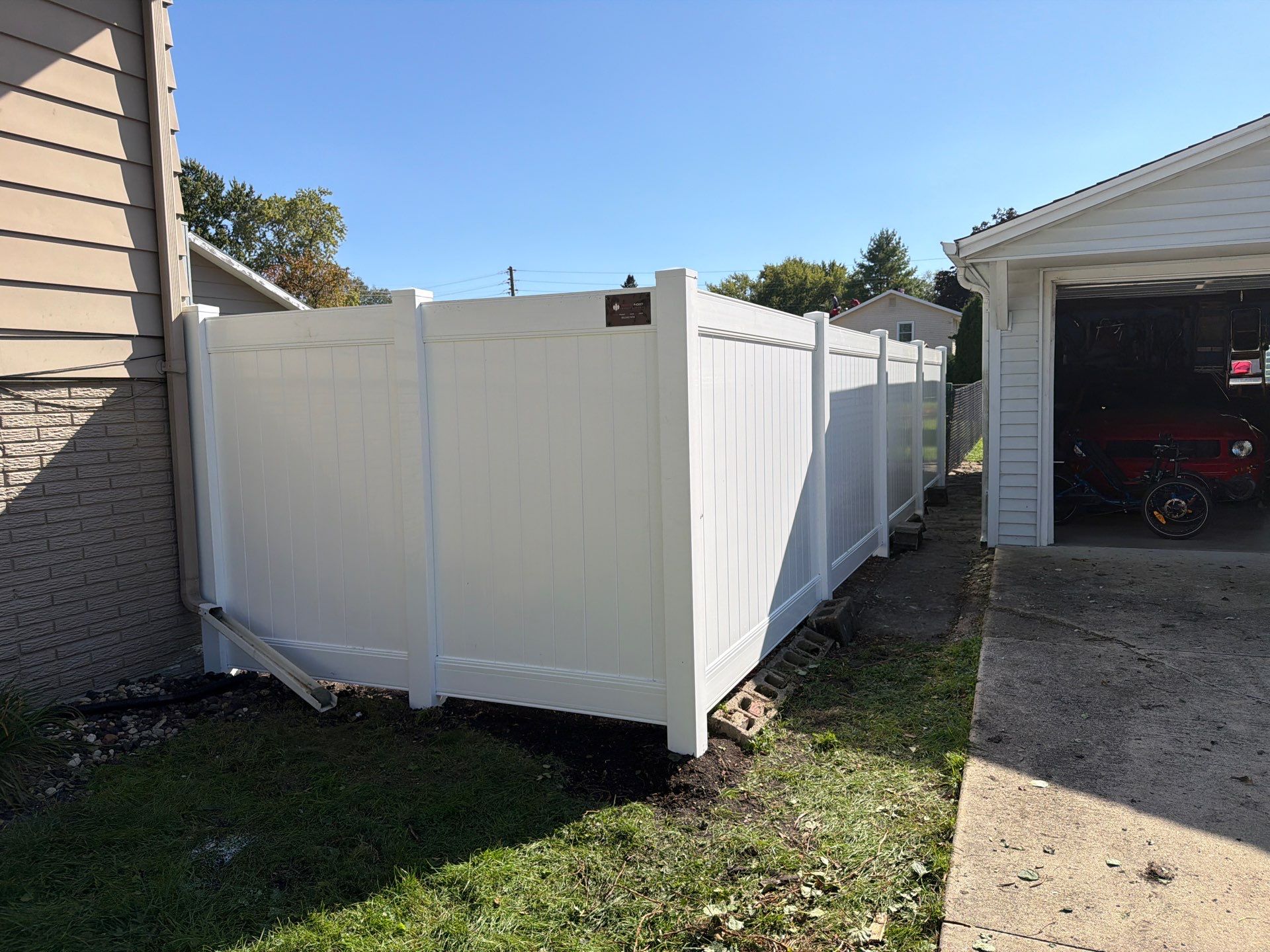 Custom Vinyl Privacy and Black Chain Link Fence Installation in Cedar Falls by Perfect Picket Fence and Stain