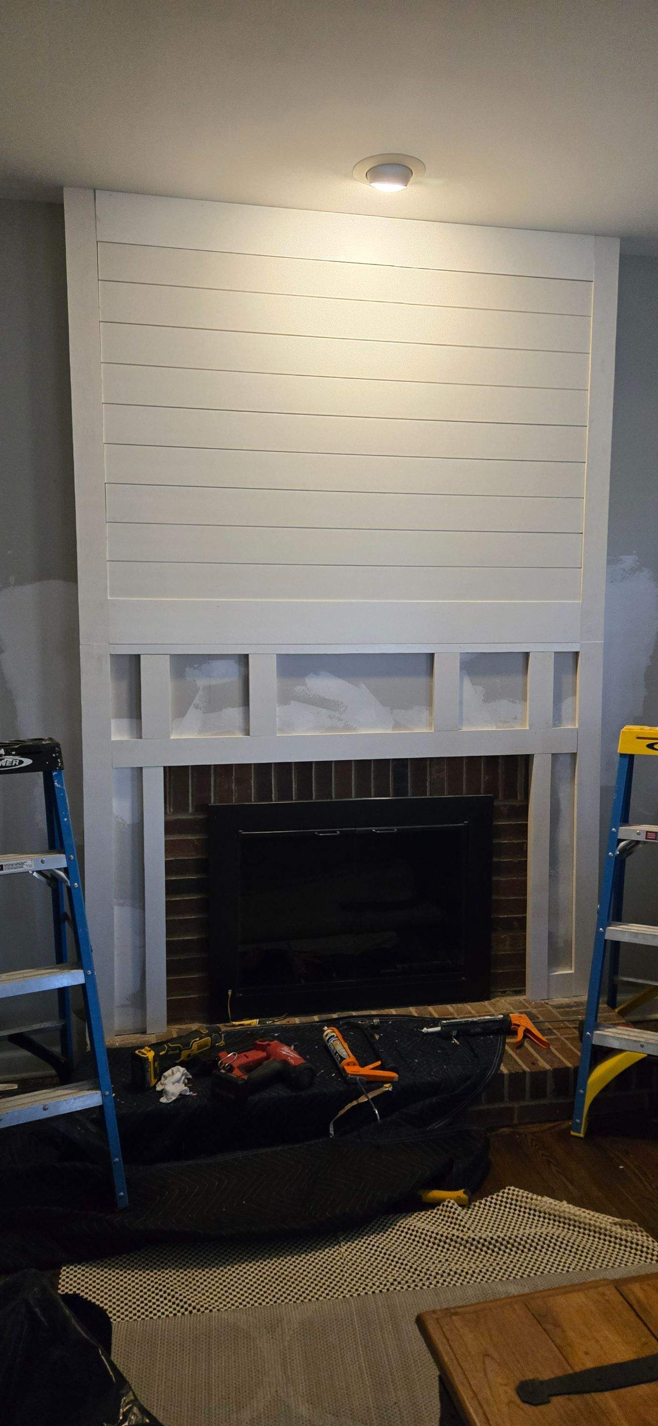 Fireplace Trim Out using Ship Lap by A Step Above Handy LLC 
