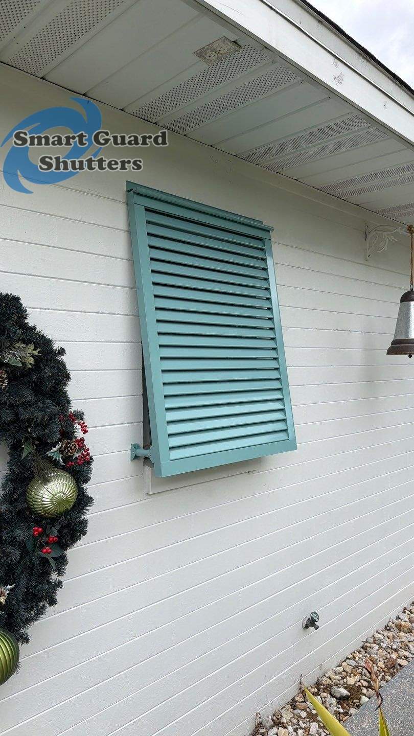 Hurricane Fabric in White / Decorative Bahama in Pastel Turquoise by Smart Guard Shutters