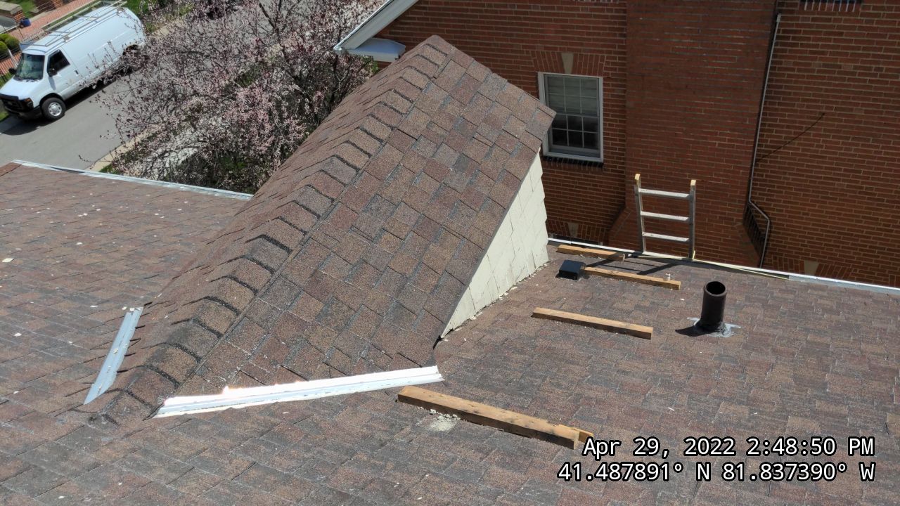 Residential Roofing Installation, Dec-tek walk-out porch roof, siding on garage by Absolute Roofing and Construction