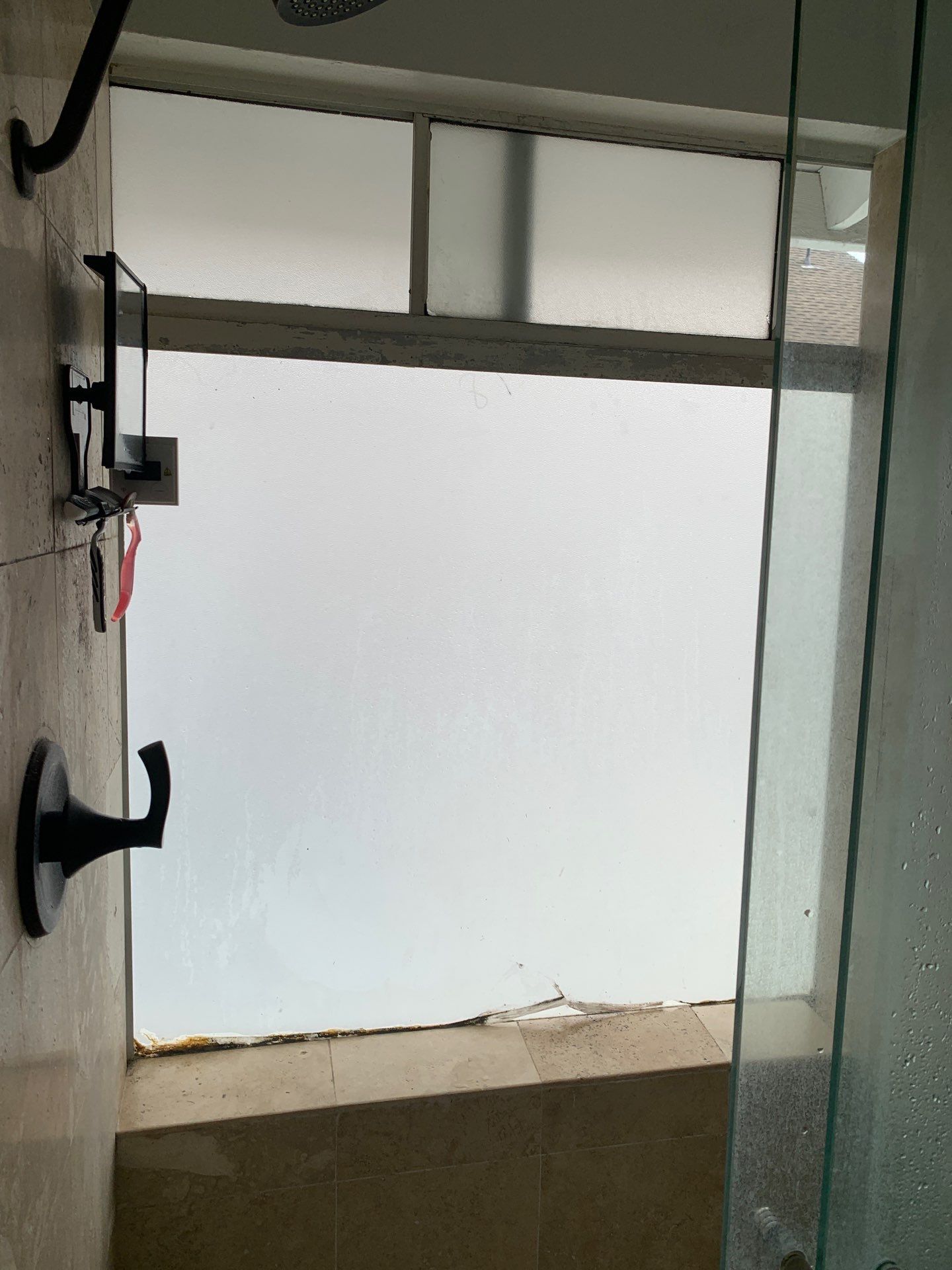 Window Installation using Milgard black vinyl windows by American Window Company