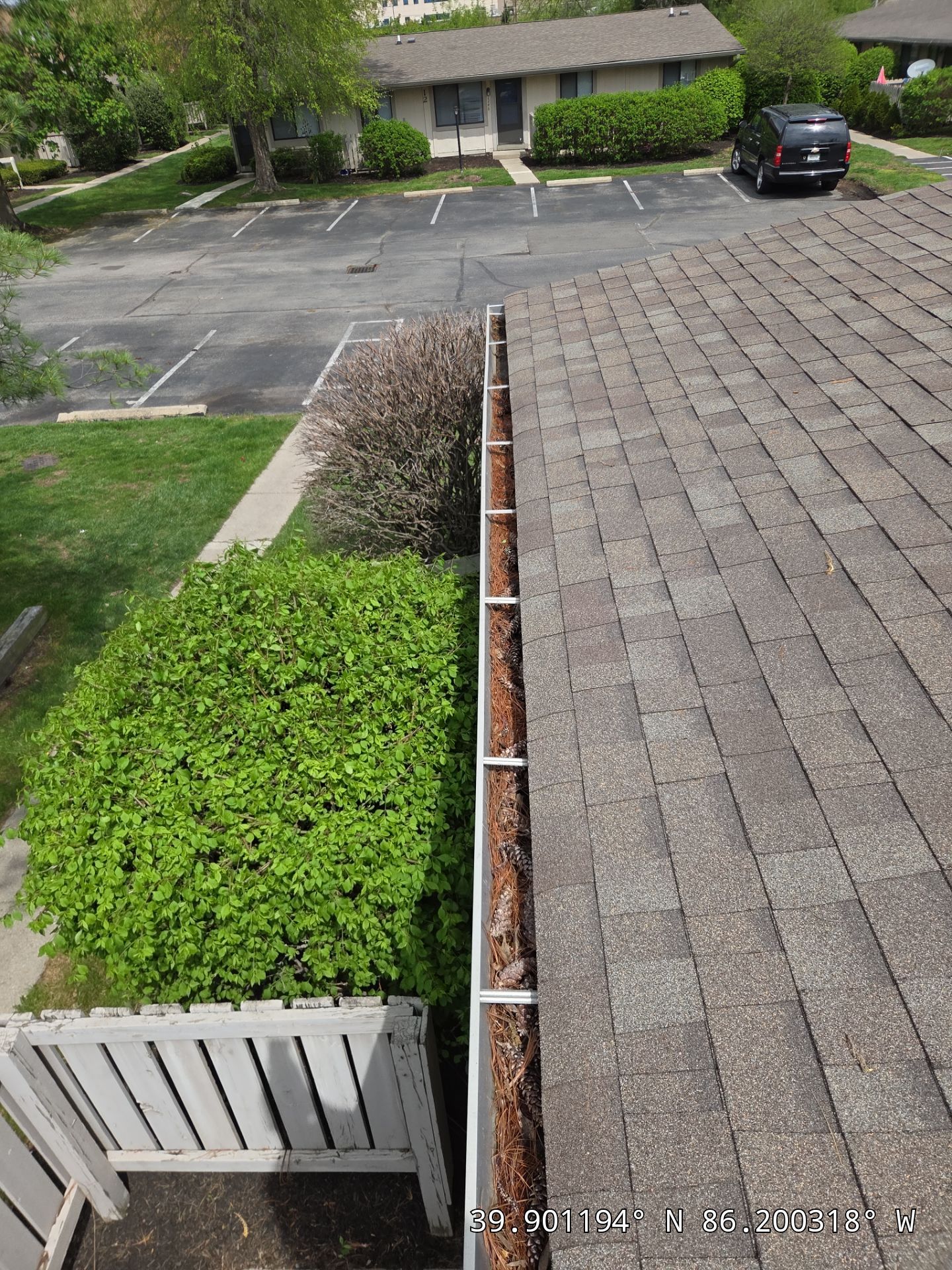 Commercial gutter cleaning Lafayette & West Lafayette before photo with filled gutters
