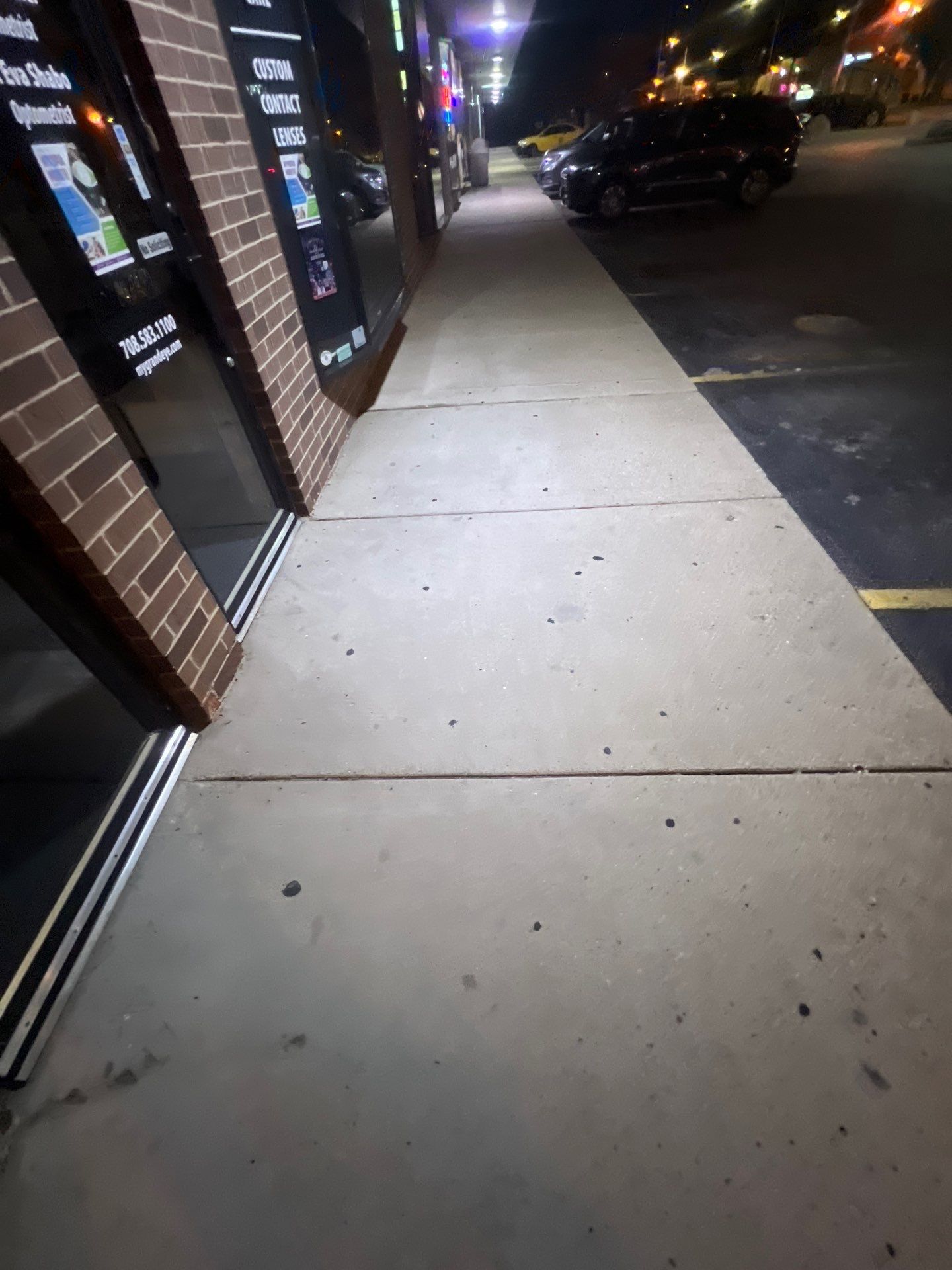 Commercial sidewalk cleaning. by Northern Power Washing LLC.