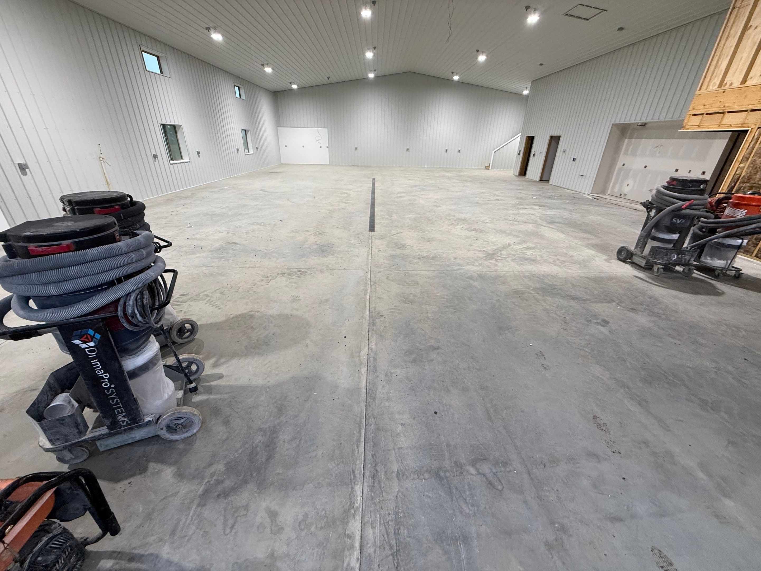 Custom Speckled Floor Coating for Large Montrose Shop by Select Painting, Coatings & Garage Cabinets