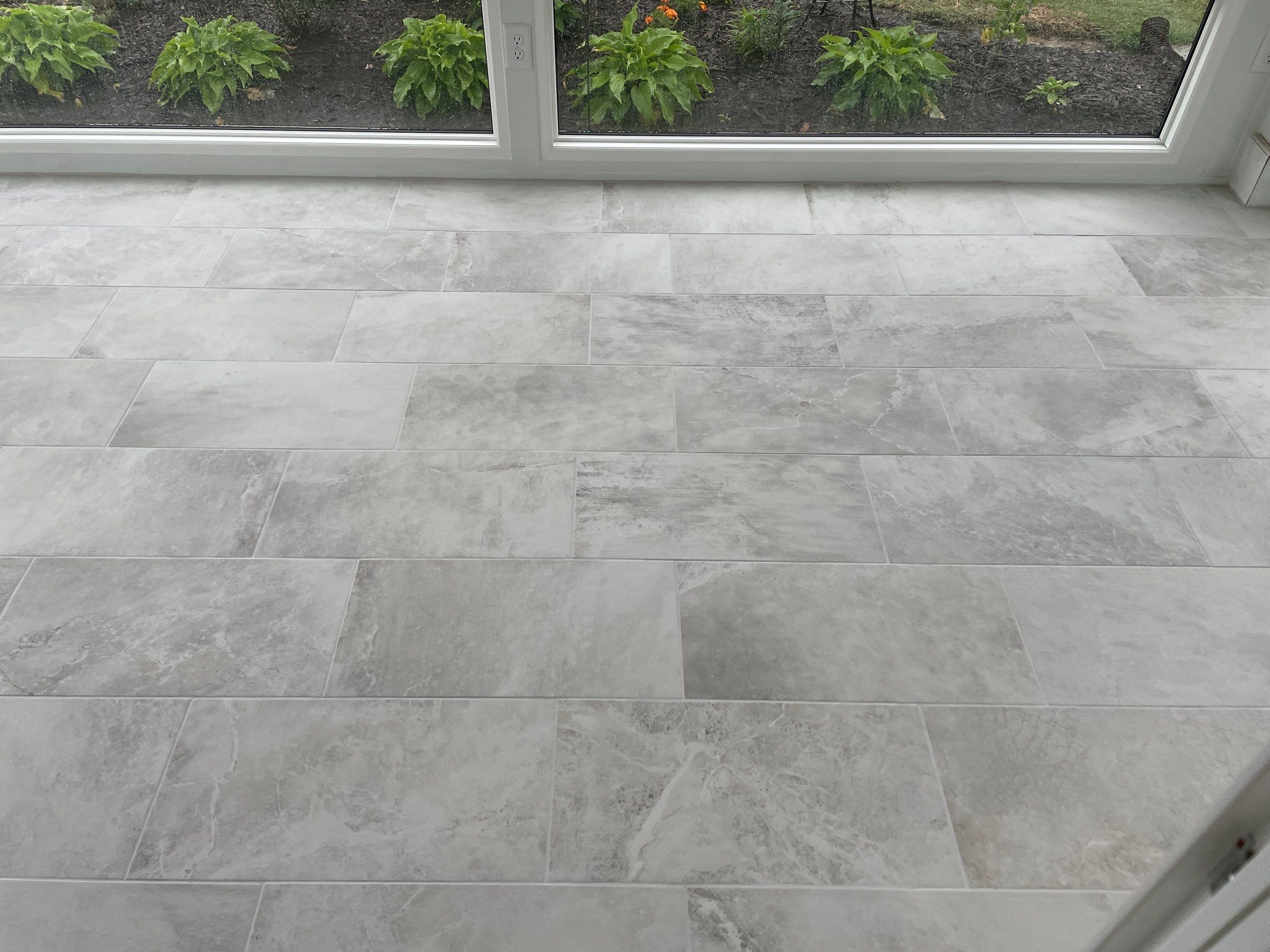 Amazing Tile Transformation After Enclosed Windows Added to Sunroom by Footprints Floors of Coastal Carolina