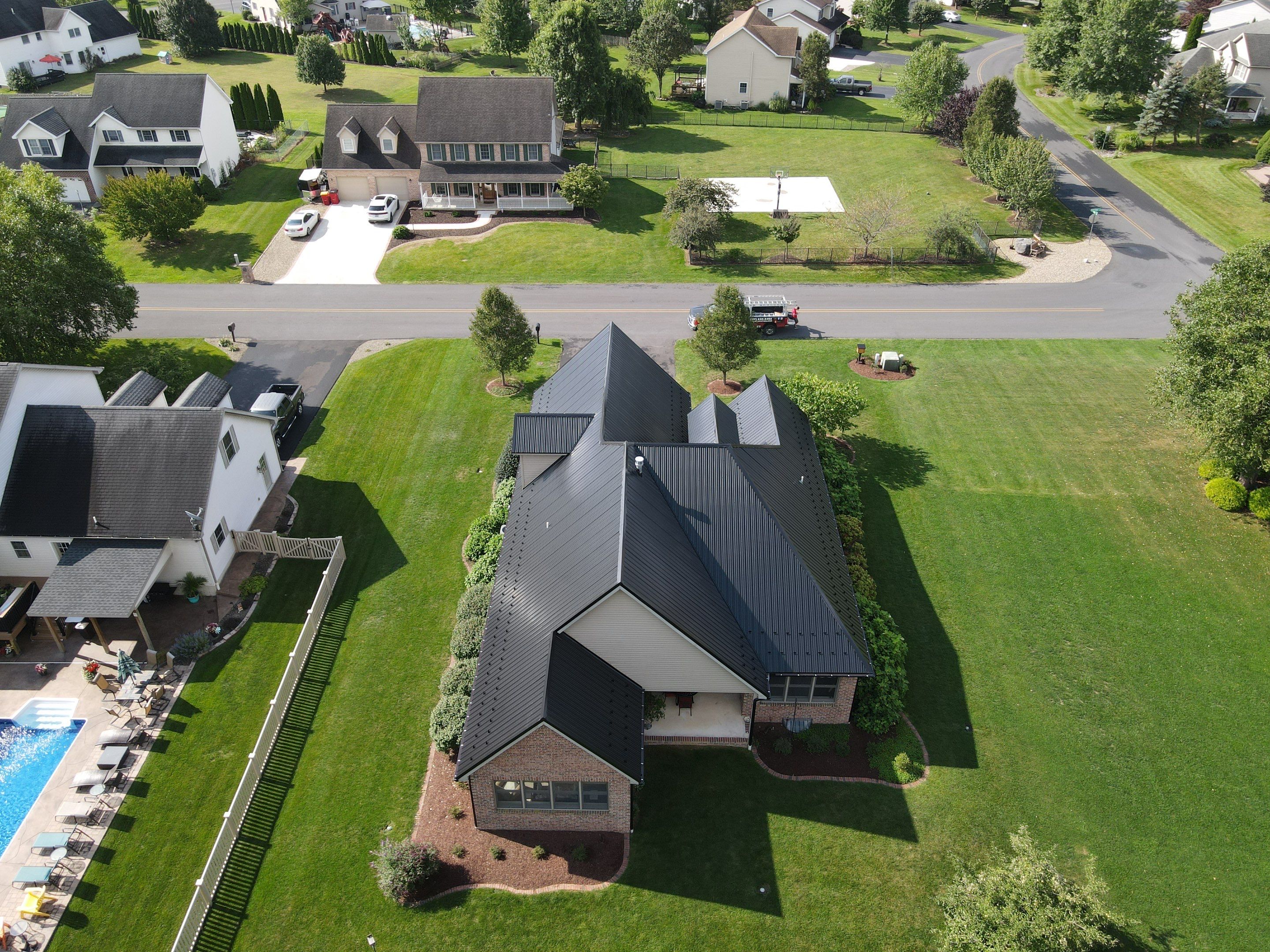 Standing seam / Azm panel in black  by Teflon Roofing