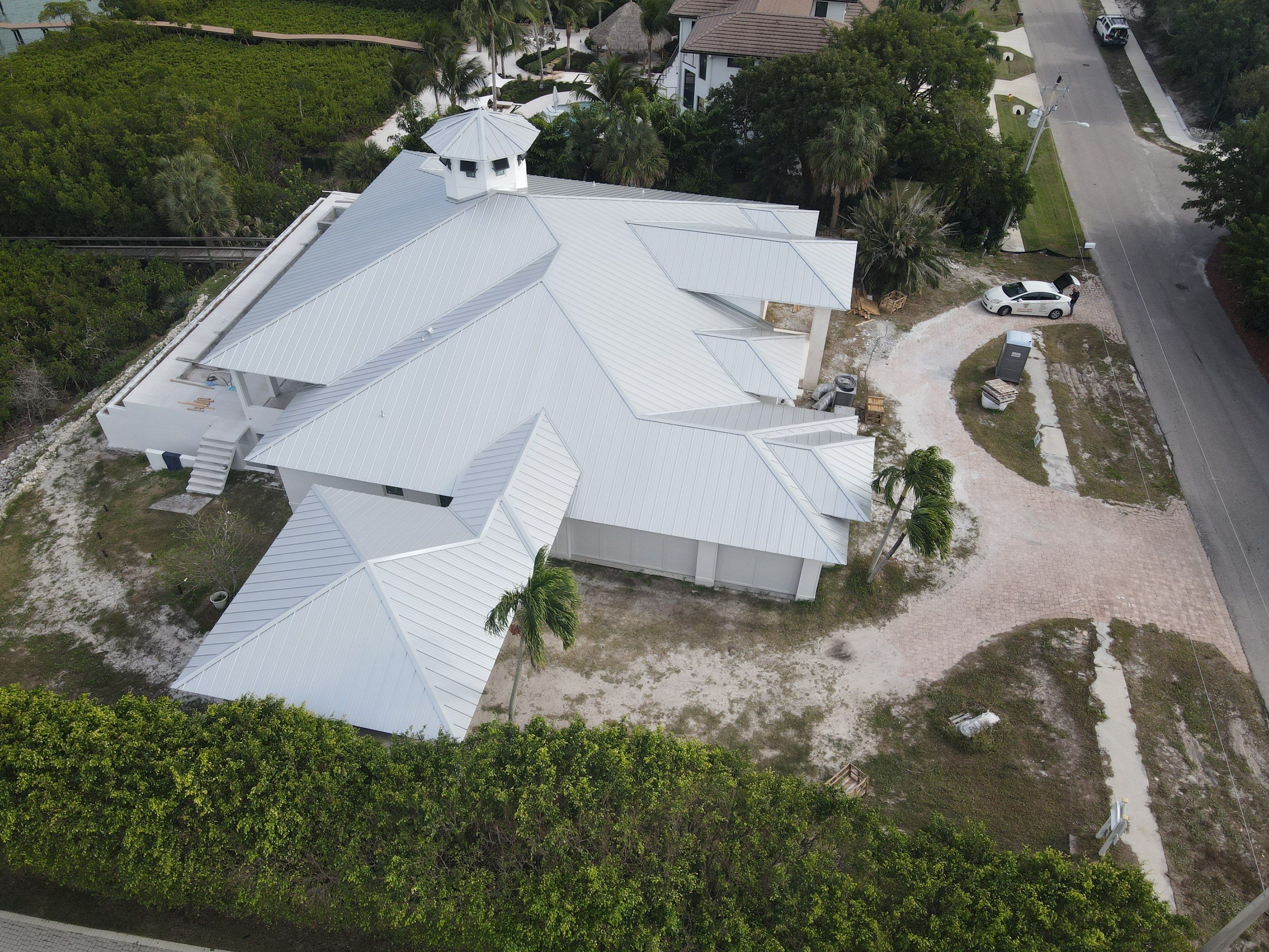 Residential Roofing Installation using Galvalume Standing Seam by Durabilis Roofing INC