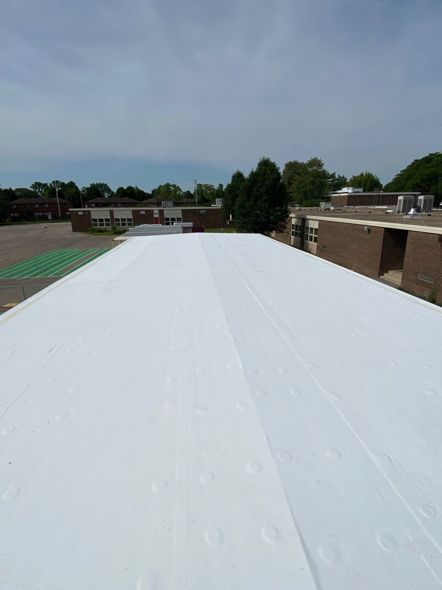 Commercial Flat Roof and Siding by Nitro Roofing and Construction
