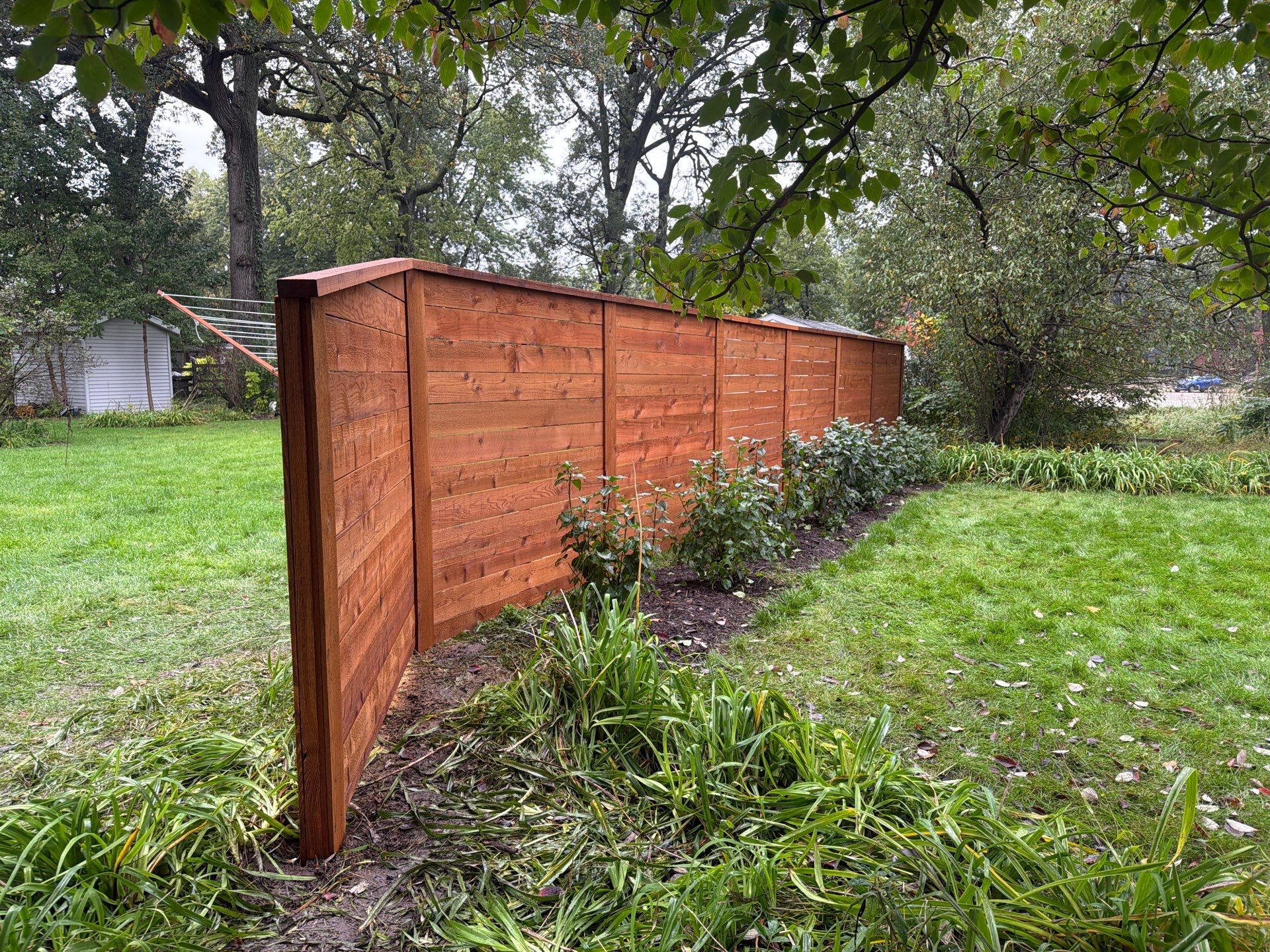 Stained Horizontal Cedar Wood Privacy Fence in Cedar Falls by Perfect Picket Fence and Stain