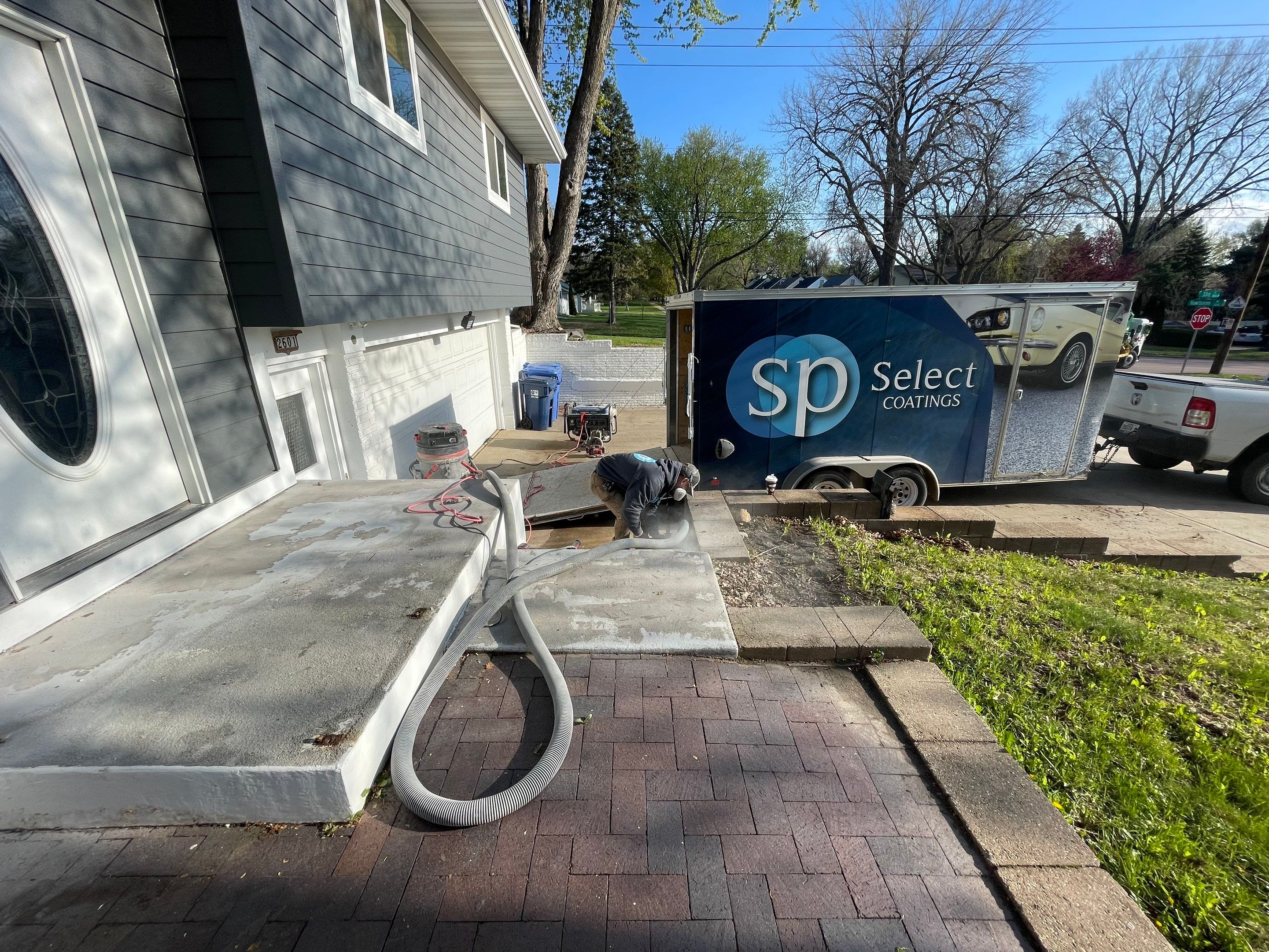 Grey Polyaspartic Porch and Stair Resurfacing in Sioux Falls by Select Painting, Coatings & Garage Cabinets